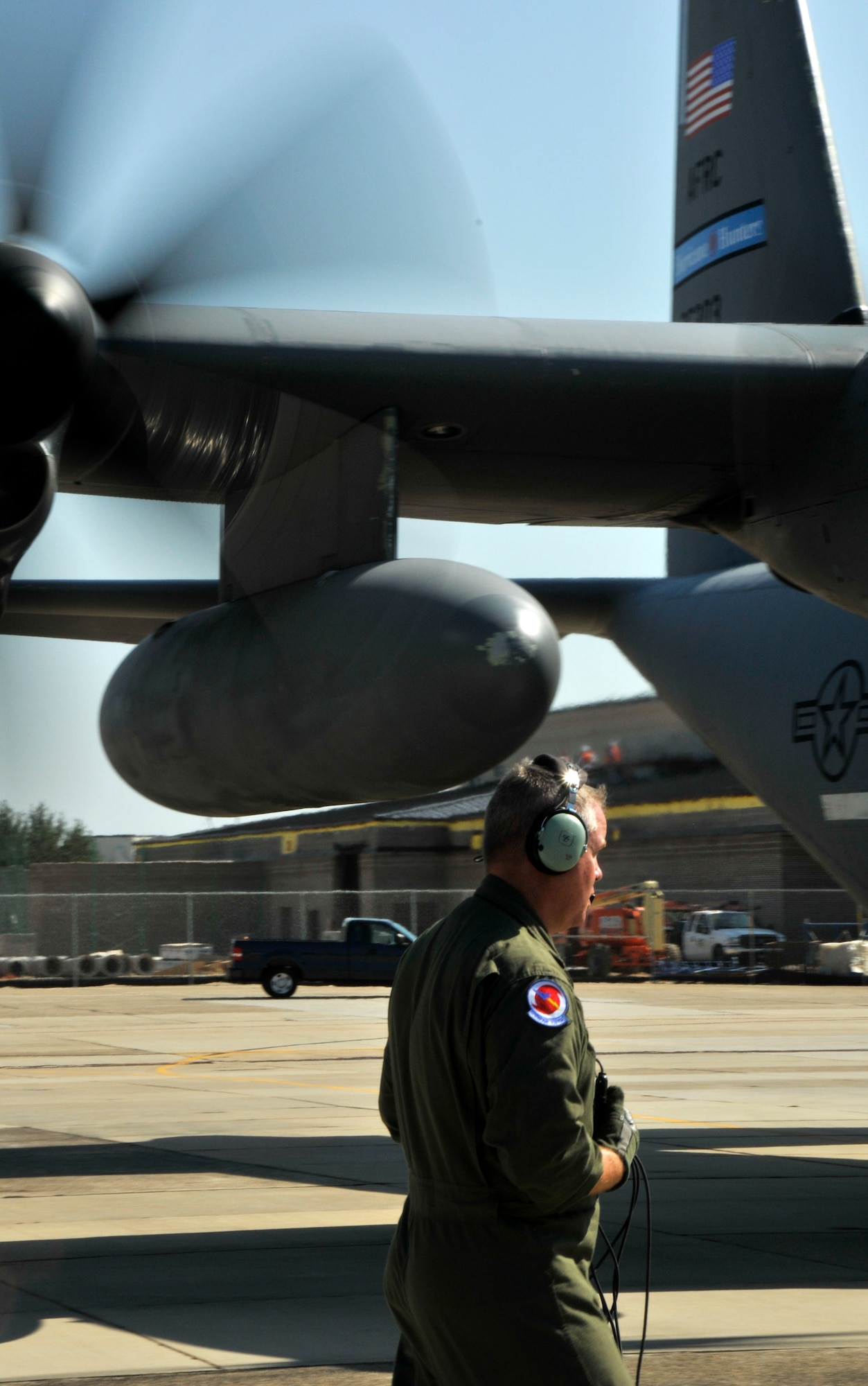 Once the six-bladed props start spinning, it's time for Weather Reconnaissance Loadmaster, Tech. Sgt. Scott Blair, to board and ensure the aircraft is closed up tight before takeoff. Sergeant Blair, a Reservist with the Hurricane Hunters, is responsible for the safety of the aircraft and is also tasked with launching and gathering weather data through the use of an instrument called a dropsonde. (U.S. Air Force Photo/Tech. Sgt. James B. Pritchett)