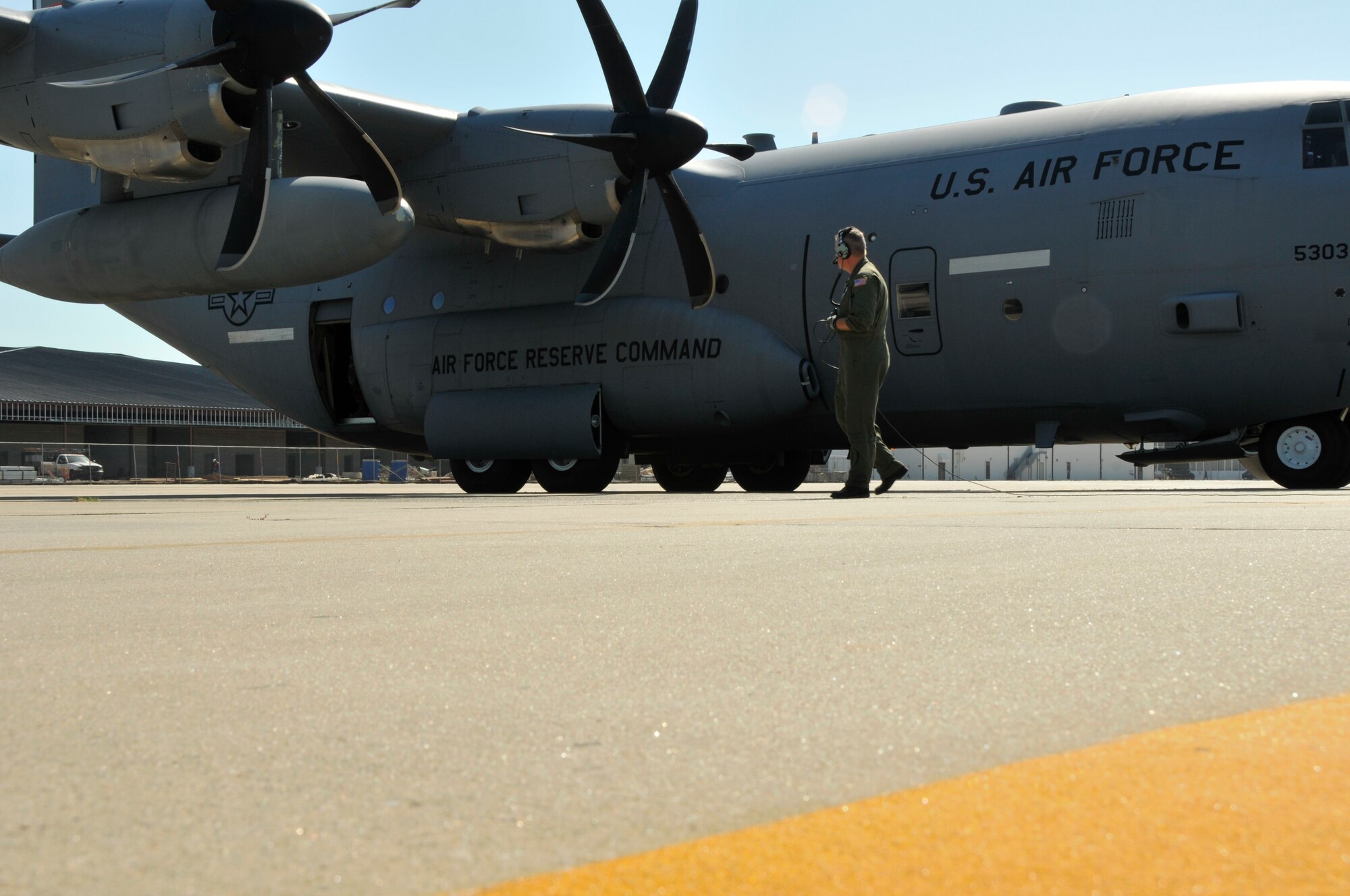 Waiting for pilots to start the engines, Tech. Sgt. Scott Blair, weather reconnaissance loadmaster, checks over the WC-130J Hurricane Hunter aircraft before departing for a mission into the eye of Hurricane Ike.  (U.S. Air Force Photo/Tech. Sgt. James B. Pritchett)