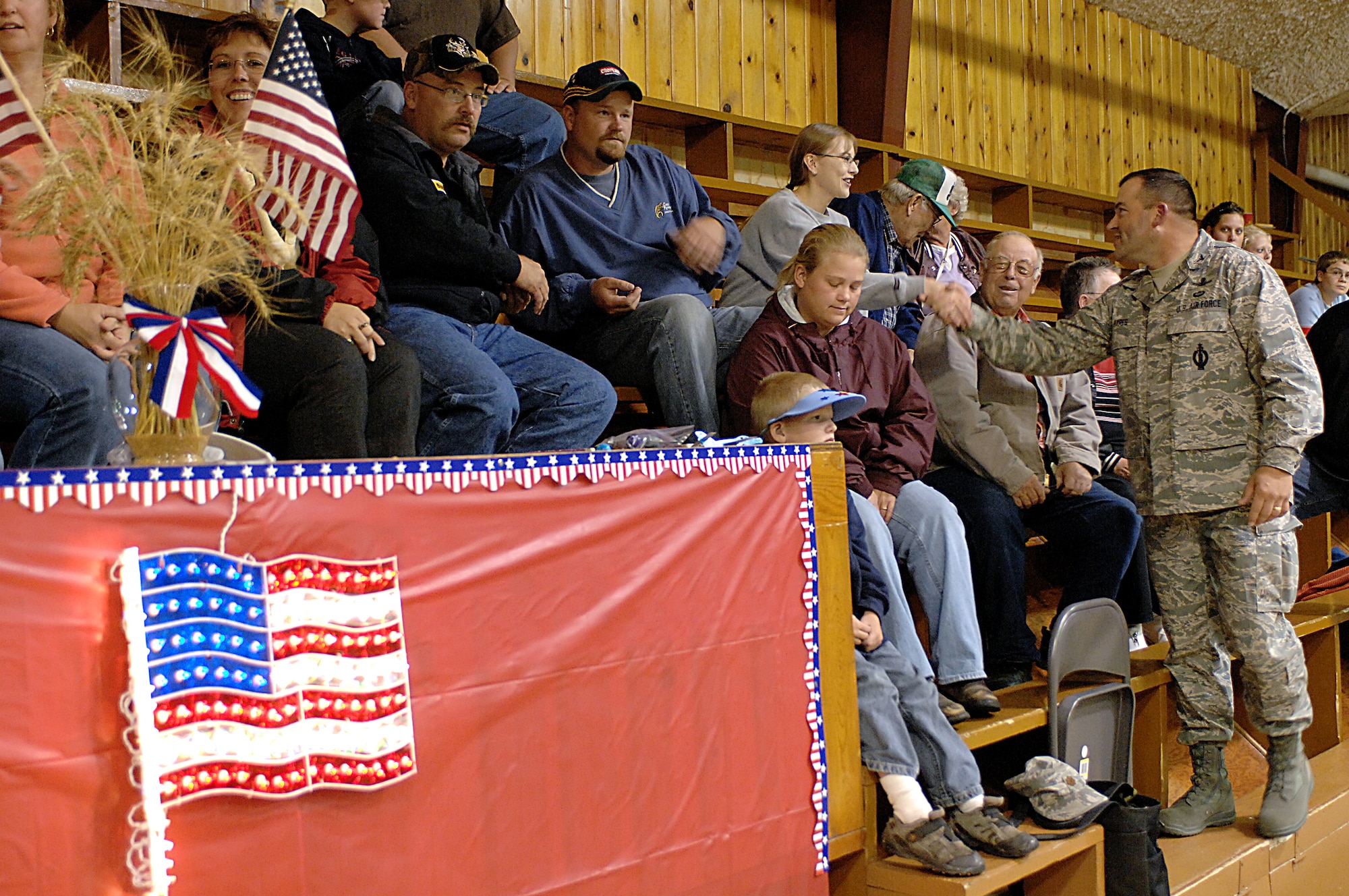 MINOT AIR FORCE BASE, N.D. -- Col. Chris Ayres, 91st Missile Wing commander, thanks members of Ryder, N.D., Sept. 4 during a community concert by Night Wing, a popular and country music ensemble with the U.S. Air Force Heartland of America Band out of Offutt AFB, Neb. The 91st MW sponsored the performance to show its appreciation to Ryder for the residents' support of the wing's ICBM mission. Approximately 150 people attended the event, which included a "burger burn" courtesy of the 741st Missile Squadron. (U.S. Air Force photo by Senior Airman Kelly Timney) 