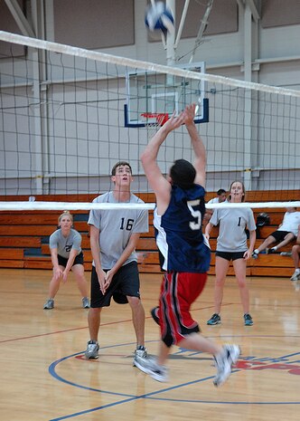 Christopher Batey hits the ball to the Flyers/OSS team during an intramural volleyball match on base Sept. 9. The Flyers/OSS team defeated the LRS 1 team 25-16, 25-21. Batey is from the 437th Logistics Readiness Squadron. (U.S. Air Force photo/Airman 1st Class Katie Gieratz)