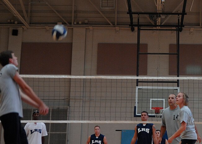 Travis Randolph prepares to bump the ball back to the LRS 1 team during an intramural volleyball match on base Sept. 9. The Flyers/OSS team defeated the LRS 1 team 25-16, 25-21. Randolph is from the 16th Airlift Squadron. (U.S. Air Force photo/Airman 1st Class Katie Gieratz)