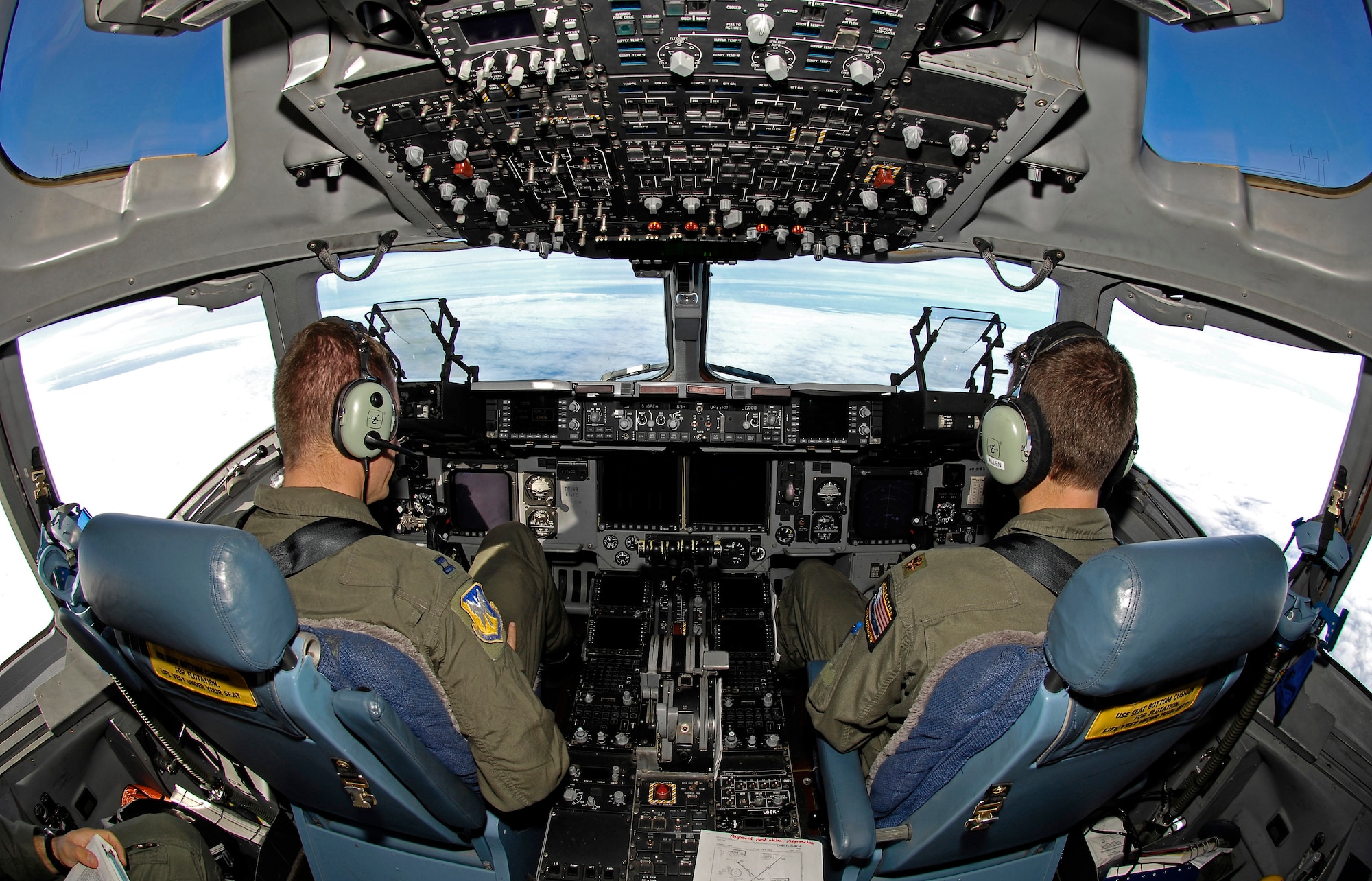 Capt. Philip Poeppelman, an active duty evaluator pilot with the 8th Airlift Squadron at McChord Air Force Base, Wash., and Maj. Jason Allen, a Reserve evaluator pilot with the 97th Airlift Squadron also at McChord, look out over the ice as they deliver more than 64,000 pounds of supplies and equipment to Antarctica on Sept. 10. The cargo movement was conducted by Joint Task Force Support Forces Antarctica, headquartered at Hickam AFB, Hawaii, and led by 13th Air Force.  The joint task force is currently conducting Operation Deep Freeze in support of the National Science Foundation and U.S. Antarctic Program.  (US Air Force photo / Master Sgt. Chris Vadnais)