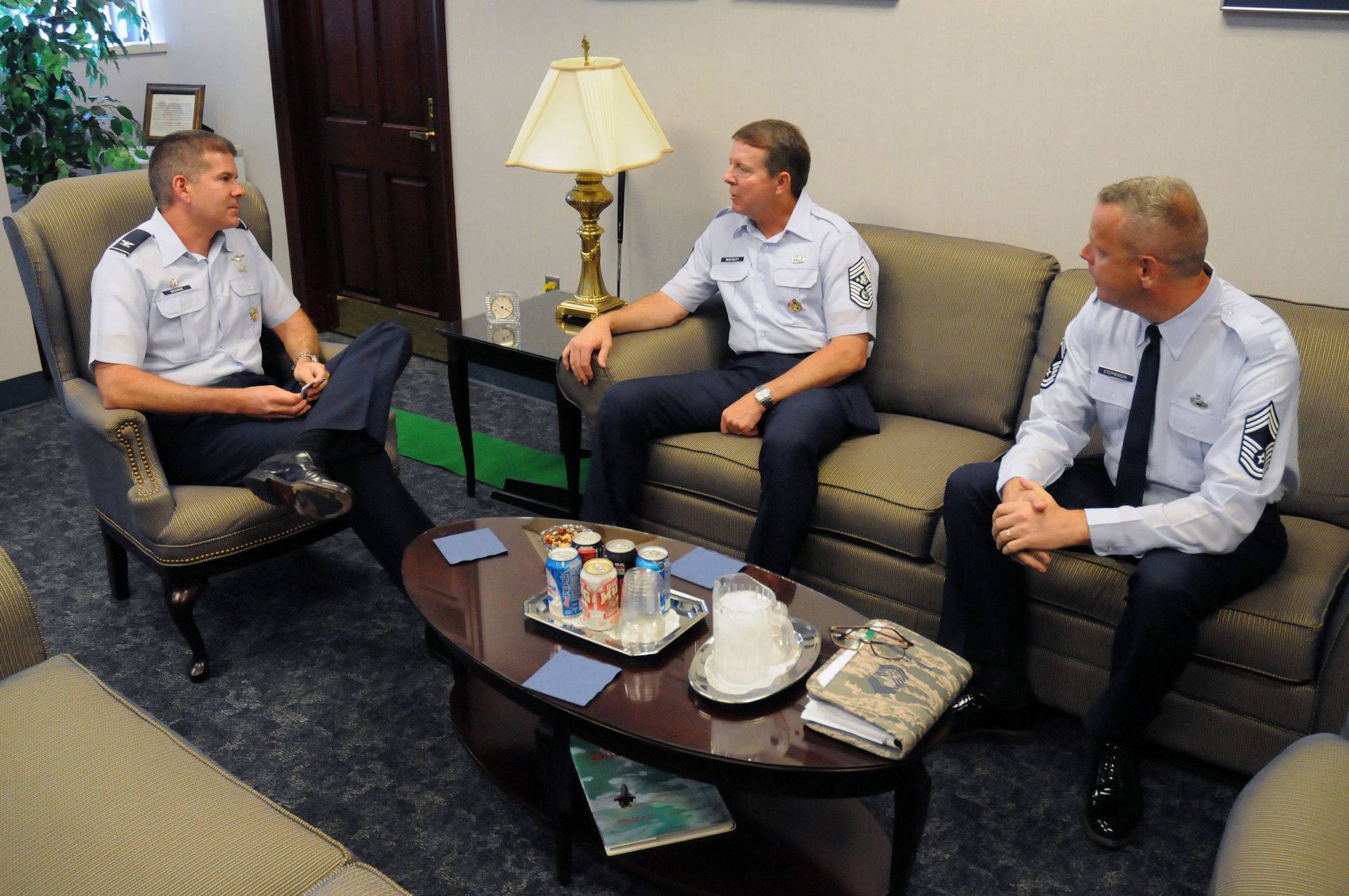 Col. D. Scott George (left) and Chief Master Sgt. Michael Stephenson brief Chief Master Sgt. of the Air Force Rodney J. McKinley during his visit Sept. 8 at Wright-Patterson Air Force Base, Ohio. During his visit, the chief visited with enlisted, officer and civilian employees and answered questions from Airmen. Colonel George is the National Air and Space Intelligence Center commander, and Chief Stephenson is the NASIC superintendent. (U.S. Air Force photo/Staff Sgt. Joshua Strang) 
