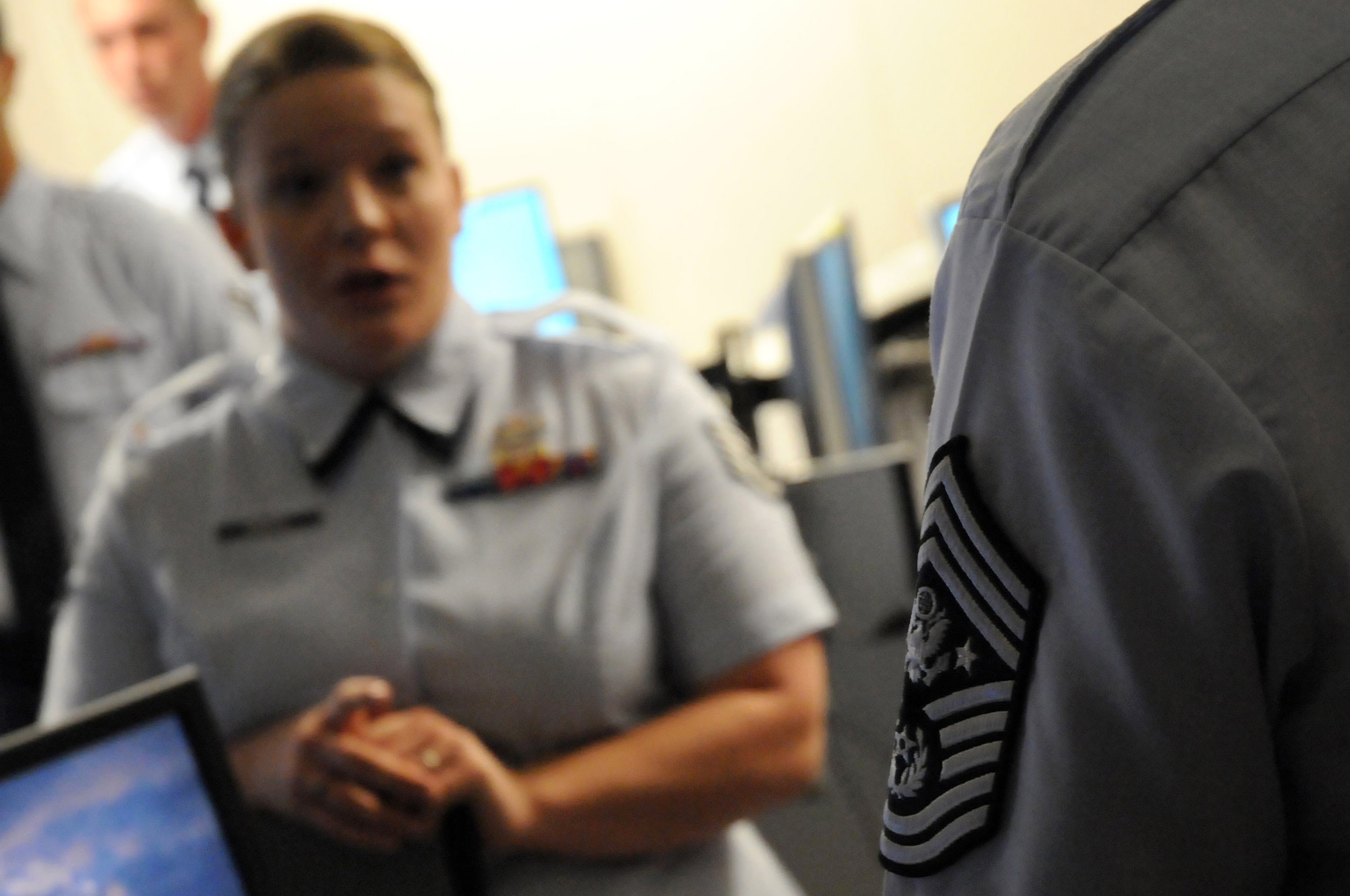 Staff Sgt. Lauren Krapfl briefs Chief Master Sgt of the Air Force Rodney J. McKinley during his Sept. 8 visit to Wright-Patterson Air Force Base, Ohio. During his visit, the chief visited with enlisted, officer and civilian employees and answered questions from Airmen. He is the 15th chief master sergeant of the Air Force. Sergeant Krapfl is assigned to the National Air and Space Intelligence Center. (U.S. Air Force photo/Staff Sgt. Joshua Strang) 
