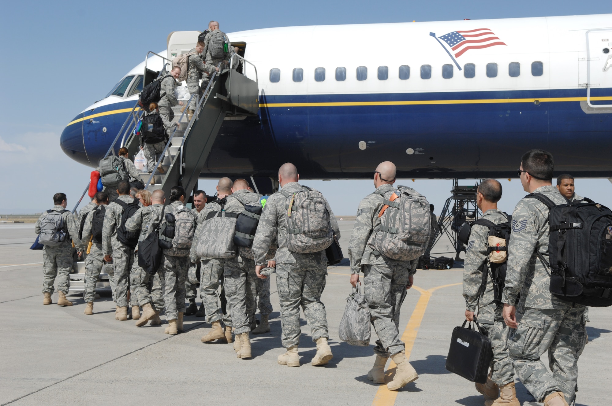 MOUNTAIN HOME AIR FORCE BASE, Idaho -- Approximately 140 Airmen from the 726th Air Control Squadron and more than 40 members of the Puerto Rico and Oregon Air National Guards board their plane to deploy to Southwest Asia Sept. 9 in support of Operation Iraqi Freedom. (U.S. Air Force photo/ Airman 1st Class Renishia Richardson)