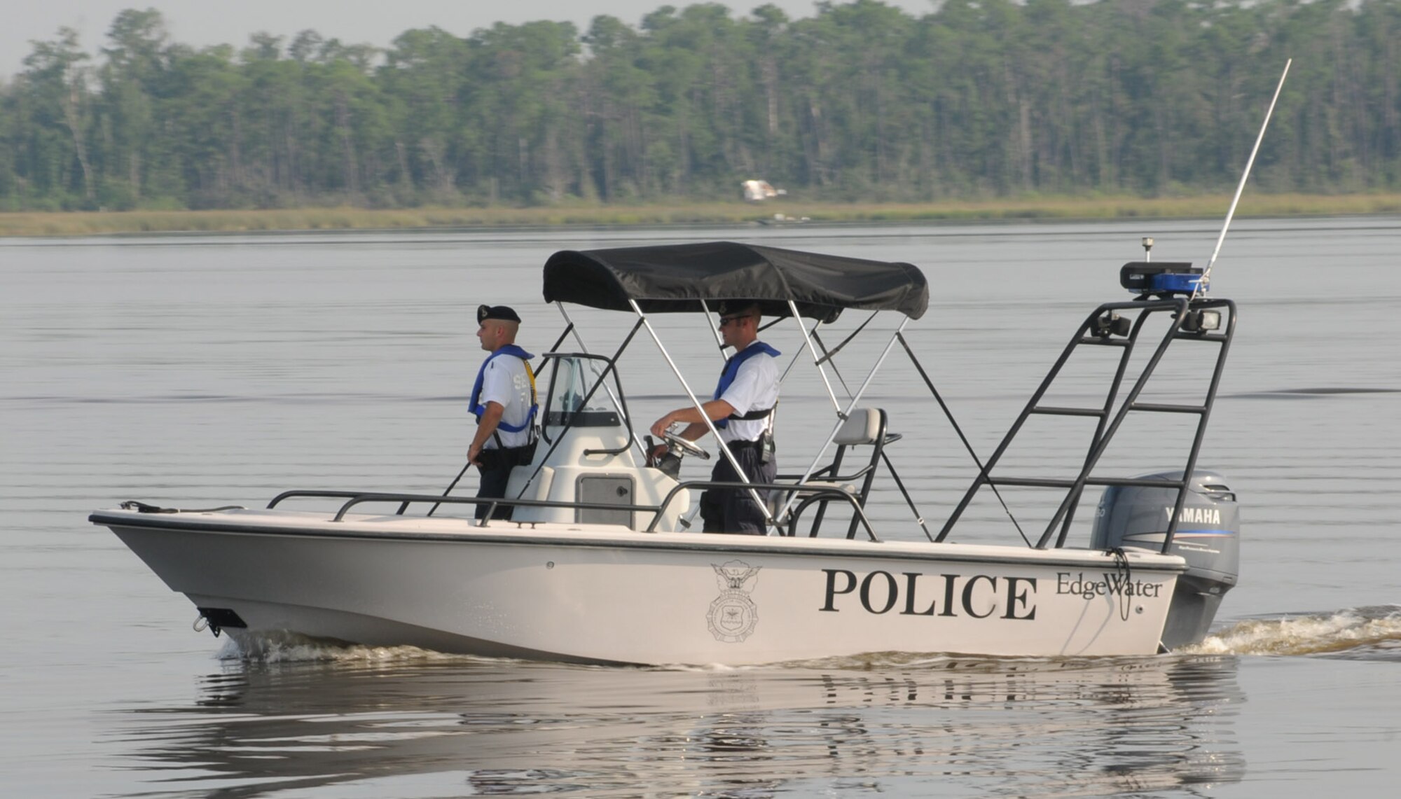 Airmen 1st Class Kevin Stahly, left, and Brian Swithenbank, Falcon Flight members, patrol Biloxi’s Back Bay, which forms Keesler’s northern boundary.  (U.S. Air Force photo by Kemberly Groue)