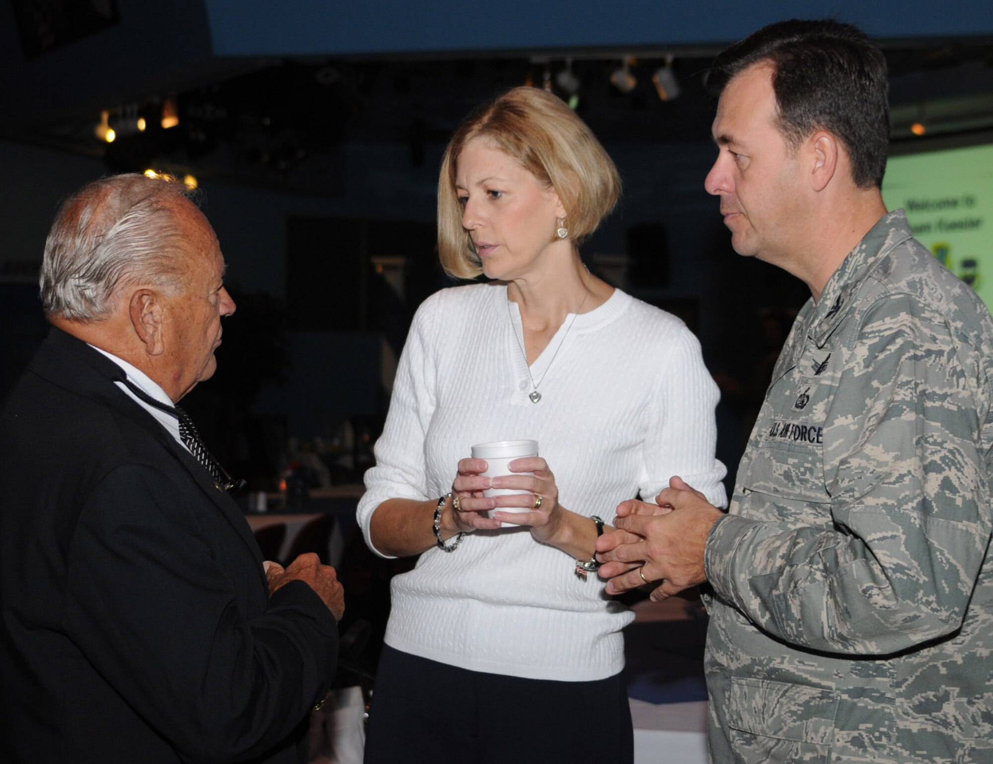 From left, Biloxi Chamber of Commerce member Dick Wilson, Charlene Touhill and Col. Greg Touhill, 81st Training Wing commander, chat at the chamber’s Morning Call Aug. 27 at the Vandenberg Community Center.  Once a year, Keesler hosts the chamber event to brief community leaders on Keesler’s status and to give base leaders a chance to network with chamber members.  (U.S. Air Force photo by Kemberly Groue)
