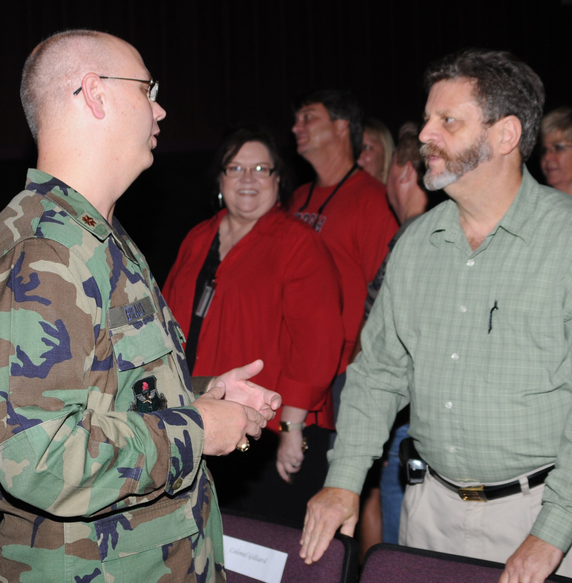 Maj. Patrick Breaux, new commander of the 81st Civil Engineer Squadron, talks to Wes Toche, base architect, after the Sept. 4 change-of-command ceremony.  Major Breaux previously served as the squadron’s operations director.  (U.S. Air Force photo by Kemberly Groue)
