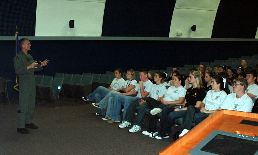 Col. Steven Chapman, 919 Special Operations Wing commander, explains the mission carried out by the men and women of the 919th SOW to ROTC cadets in a welcome briefing Sept. 5. The 919th SOW hosted a tour of the base for more than 70 high school seniors in ROTC from three local schools. The cadets' tour gave them an inside look into maintenance and flying functions of the wing. (US Air Force Photo/Senior Airman Jon McCallum)