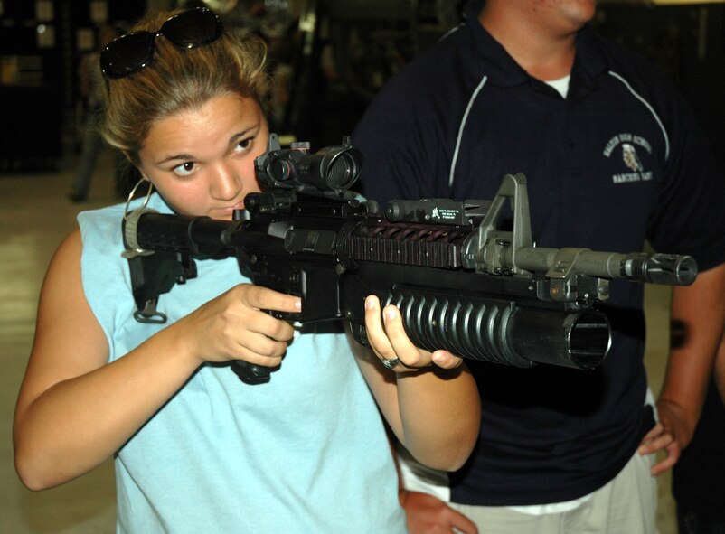 A ROTC cadet from Walton High School Fla. looks through the sites on one of the weapons displayed by security forces during a tour of the 919 Special Operations Wing Sept. 5. The 919th SOW hosted a tour of the base for more than 70 high school seniors in ROTC from three local schools. The cadets' tour gave them an inside look into maintenance and flying functions of the wing. (US Air Force Photo/Senior Airman Jon McCallum) 