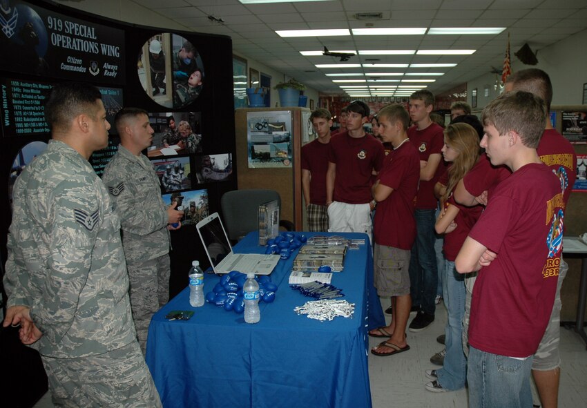 Staff Sergeants Angel Velasquez (far left) and Brian Paavo (left), 919 Special Operations Wing recruiters, explain the many career and educational possibilities available in the Air Force Reserve to ROTC cadets from Niceville High School. The 919th SOW hosted a tour of the base for more than 70 high school seniors in ROTC from three local schools. The cadets' tour gave them an inside look into maintenance and flying functions of the wing. (US Air Force Photo/Senior Airman Jon McCallum) 