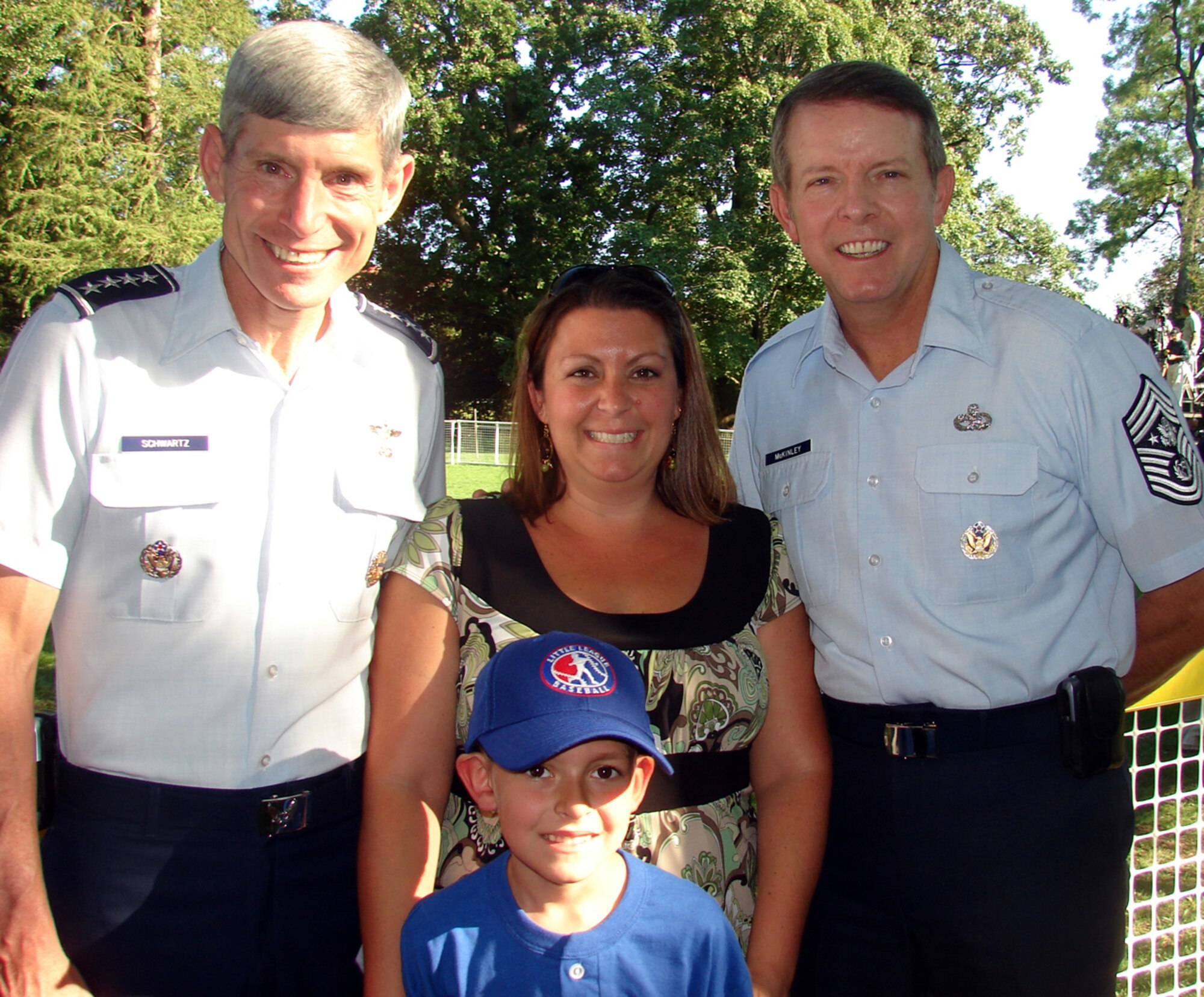 Kasen Warrick, 6, and his mother, Kyan, pose with Air Force Chief of Staff General Norton A. Schwartz, left, and Chief Master Sergeant of the Air Force Rodney McKinley, after Tee Ball on the South Lawn at the White House Sept. 7. Kasen was selected to play tee ball with President Bush in the last game of his administration. The final game was dedicated to military families. Master Sgt. James Warrick, 305th Security Forces Squadron, is Kasen’s father. (U.S. Air Force courtesy photo)
