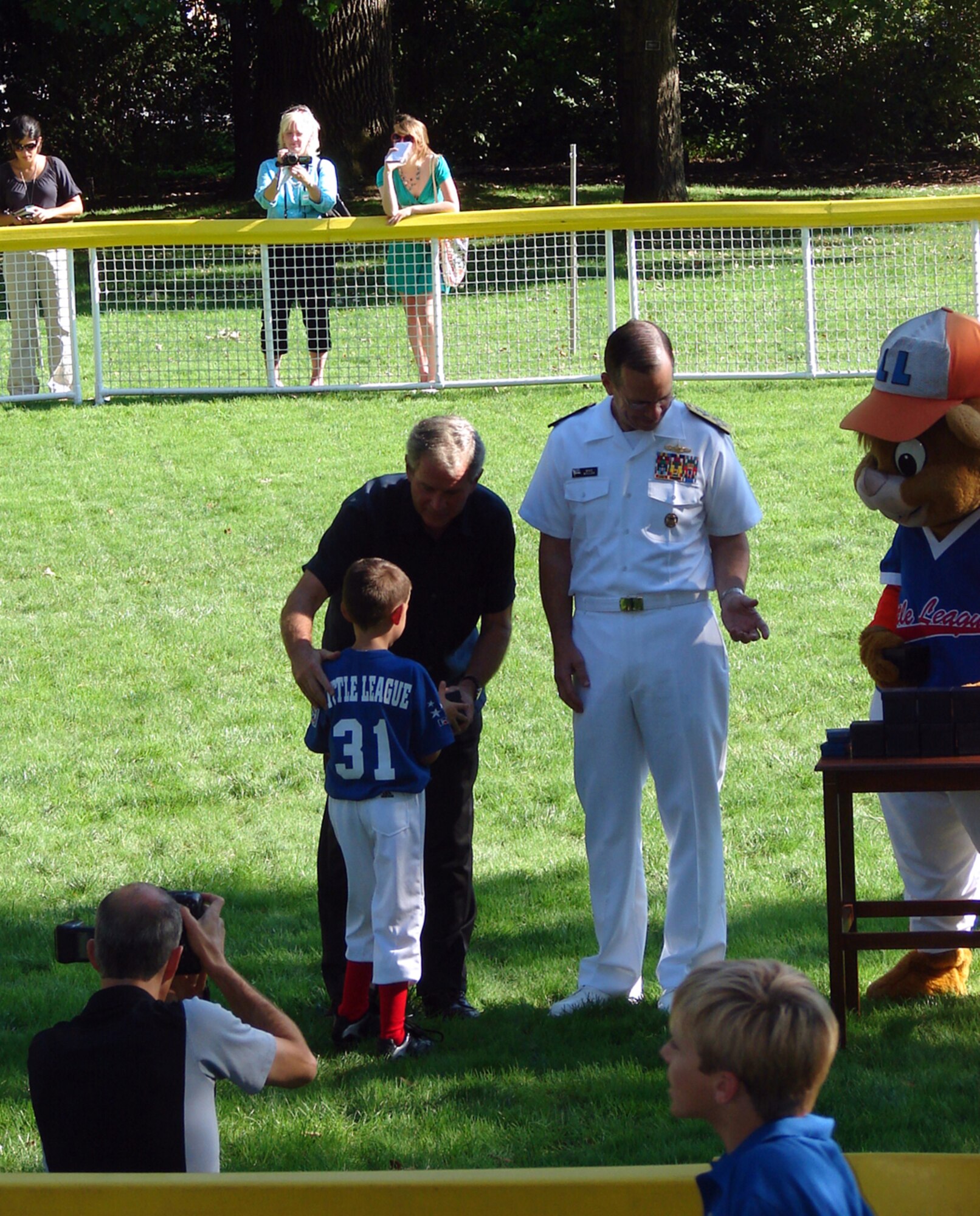 Kasen Warrick, No. 31, receives an autographed baseball from President George Bush after Tee Ball on the South Lawn at the White House Sept. 7. Kasen, 6, was selected to play in the final tee ball game of President Bush’s administration. The final game was dedicated to military families. Master Sgt. James Warrick, 305th Security Forces Squadron, is Kasen’s father. (U.S. Air Force courtesy photo)