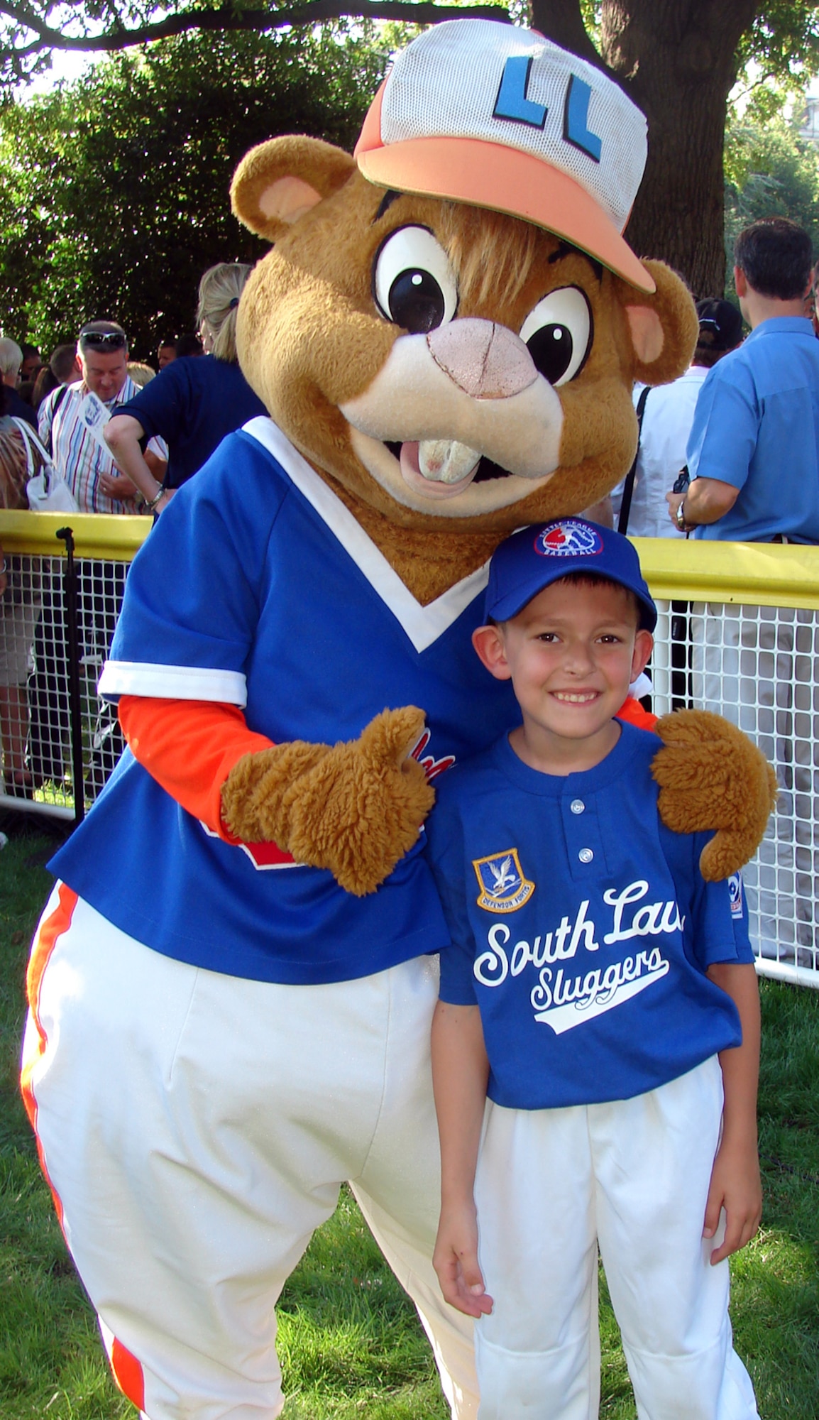 Kasen Warrick hangs out with the Little League mascot, Dugout, during Tee Ball on the South Lawn at the White House Sept. 7. Kasen, 6, was selected to play tee ball with the president of the United States in the last tee ball game of President Bush’s administration. The final game was dedicated to military families. Master Sgt. James Warrick, 305th Security Forces Squadron, is Kasen’s father. (U.S. Air Force courtesy photo)