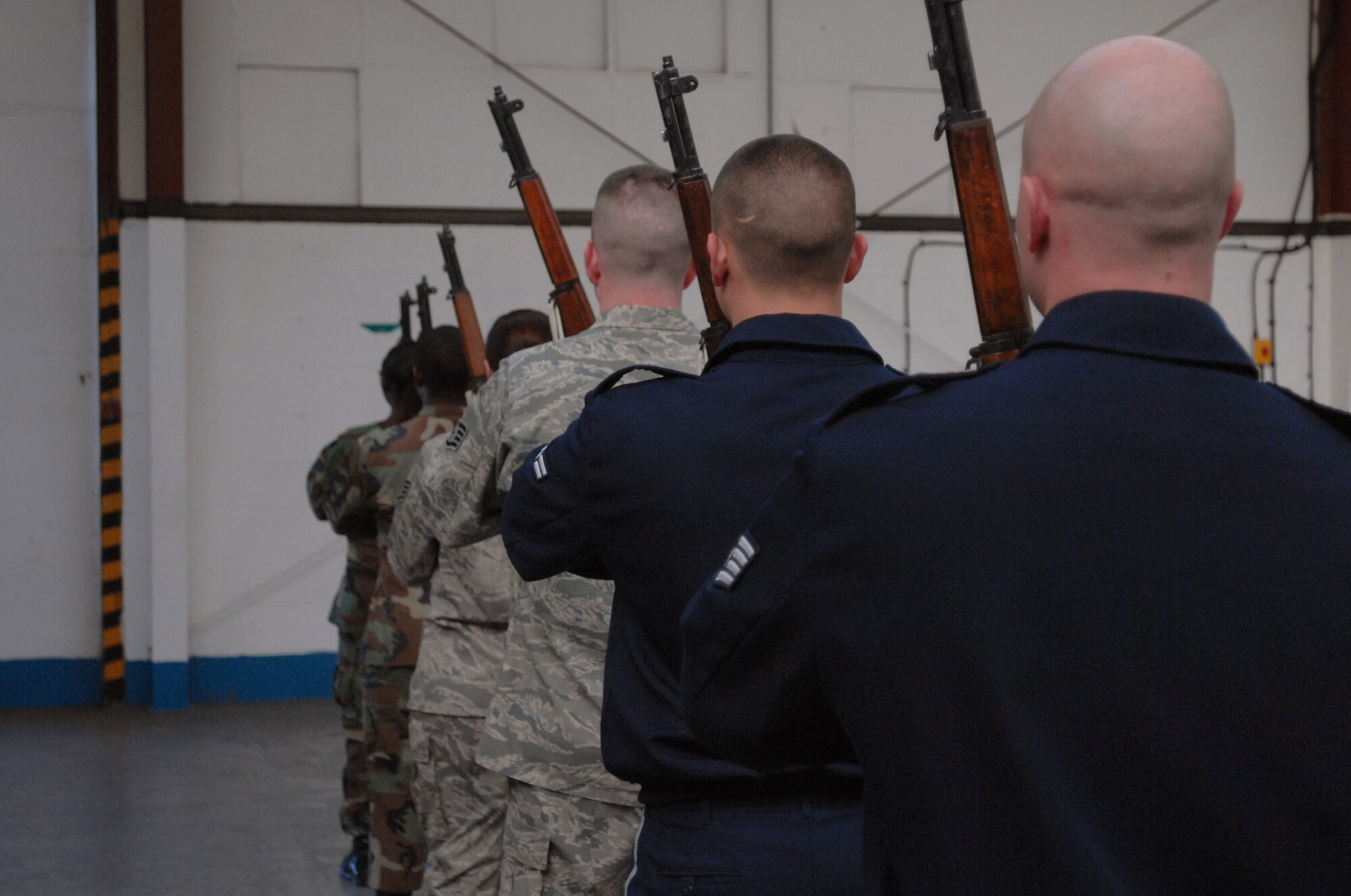 Members of Team Mildenhall Honor Guard practice their role as a “firing party” during weekly practice Sept. 3, 2008. The main goal of the honor guard is to honor fallen veterans. They also honor those who retire, post colors for changes of command, and participate in parades and special events. (U.S. Air Force photo by Senior Airman Teresa M. Hawkins)