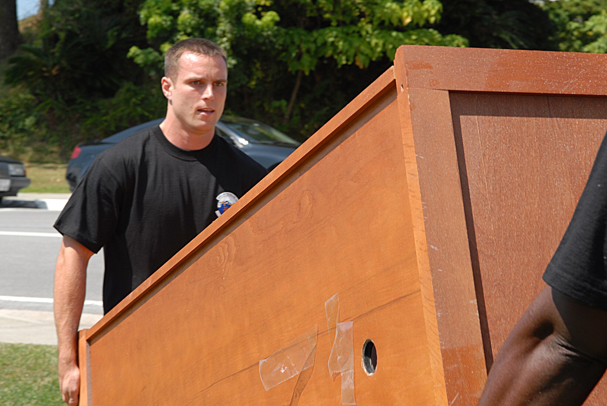 Capt. Paul Curtiss, 909th Air Refueling Squadron at Kadena Air Base, volunteers to help move furniture for the Storks Nest renovation project at Camp Lester.
(U.S. Air Force photo/Staff Sgt Angelique Perez)
