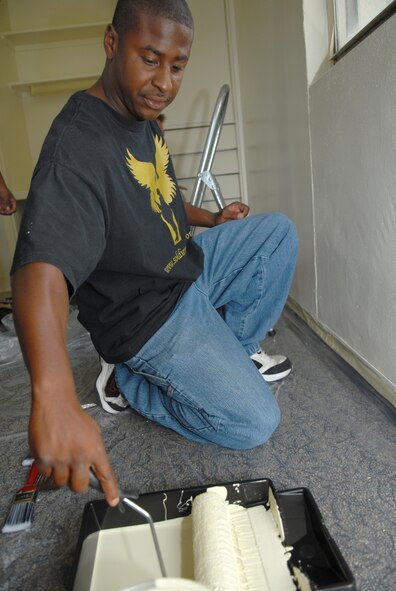 CAMP LESTER, Japan -- Senior Airman Hunlon Polk, 18th Equipment Maintenance Squadron at Kadena Air Base, volunteers to help paint rooms for the Stork's Nest renovation project. (U.S. Air Force photo/Staff Sgt Angelique Perez) 