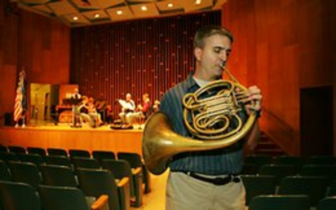 US Air Force Technical Sgt. Hughey Hancock practices a melody line in Swarthout Recital Hall an hour before Monday night's performance by Winds of Freedom, a six-piece ensemble of Air Force musicians that regularly tours the Midwest. Members of the group have performed around the world with other Air Force groups. (Photo by Ryan McGeeney/The University Daily Kansan)