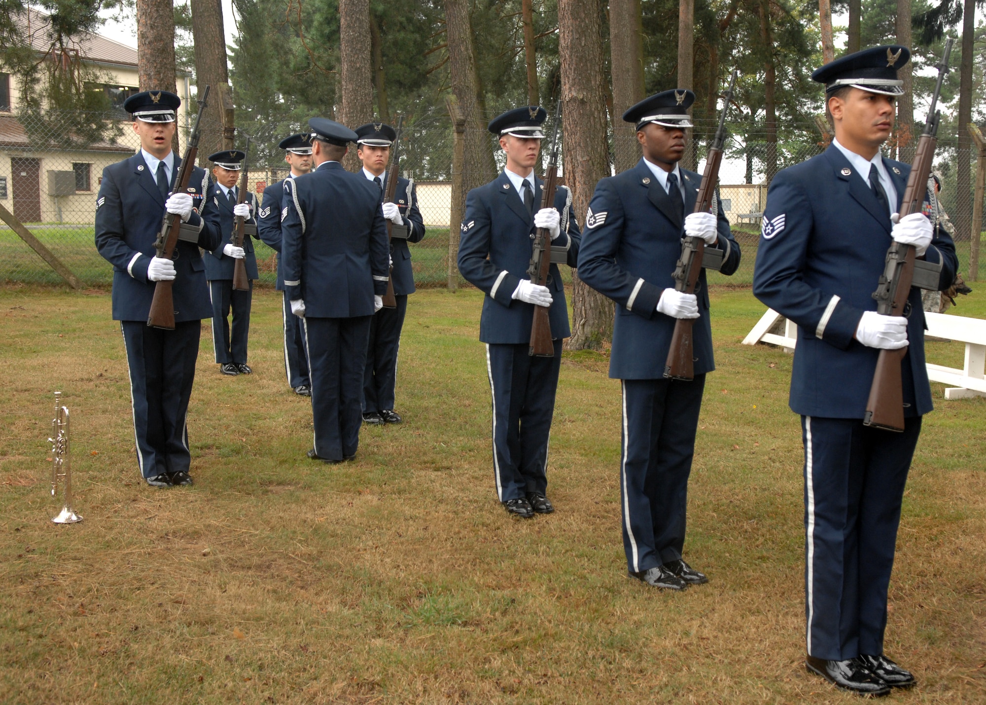 SPANGDAHLEM AIR BASE, Germany – The base Honor Guard gave a 21-gun salute to honor the retired and fallen Military Working Dogs, during an MWD memorial, Sept. 3, 2008. The ceremony included a memorial plaque that honored 11 MWDs, five of which completed their military service and were adopted by their handlers. The other seven MWDs died while on active duty of natural causes. (U.S. Air Force photo by Airman Staci Miller)