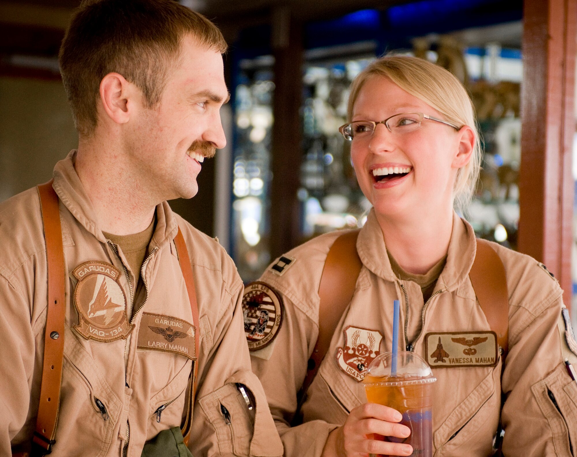 BAGRAM AIR FIELD, Afghanistan -- Naval aviator Lt. Larry Mahan and his wife, Air Force F-15E Strike Eagle weapons systems officer Capt. Vanessa Mahan celebrate their first anniversary over iced tea here September 1, 2008. The couple celebrated together against great odds thanks to the help of the Captain Mahans’s home unit, the 335th Fighter Squadron, Seymour Johnson Air Force Base, N.C., and the 455th Air Expeditionary Wing here. Captain Mahan is from St. John, Ind. (U.S. Air Force photo by Staff Sgt. Samuel Morse/Released)
