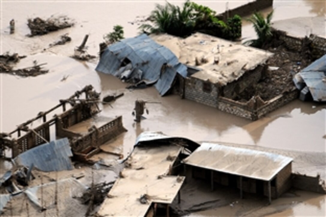 An aerial view shows the devastation in Port de Paix after four storms in one month killed more than 800 people. The amphibious assault ship USS Kearsarge was diverted from Continuing Promise 2008, a humanitarian mission, in the western Caribbean to conduct hurricane relief operations in Haiti, Sept. 8, 2008. 

