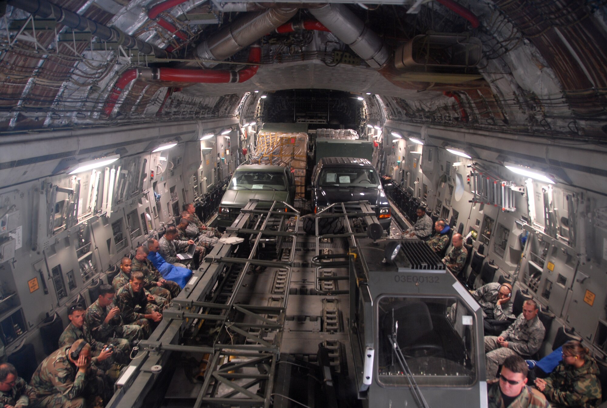 Airmen from the 617th Contingency Response Wing, McGuire Air Force Base, N.J., travel with their equipment on a C-17 Globemaster III flown by a crew assigned to the 58th Airlift Squadron, Altus AFB, Okla., Sept. 10. The airmen and cargo were flown to Harlingen, Texas, to equip an emergency evacuation in preparation for Hurricane Ike. (U.S. Air Force photo/Airman 1st Class Cherice I. Bryant)