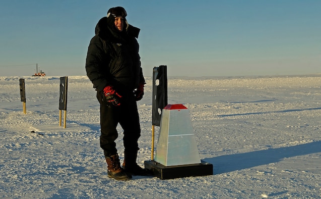 Maj. Corey Simmons, a C-17 evaluator pilot with the 62nd Operations Support Squadron at McChord Air Force Base, Wash., stands next to a reflective cone on the Pegasus Ice Runway near McMurdo Station, Antarctica, on Sept. 10. These small reflective cones were used in combination with night vision goggles by C-17 Globemaster III pilots to land on the runway at night during a Sept. 11 mission.  The mission was flown as part of Operation Deep Freeze, commanded by U.S. Pacific Command's Joint Task Force Support Forces Antarctica. Headquartered at Hickam AFB, Hawaii, and led by 13th Air Force, JTF SFA's mission is to provide air- and sealift support to the National Science Foundation and U.S. Antarctic Program. 
(US Air Force photo / Master Sgt. Chris Vadnais) 
