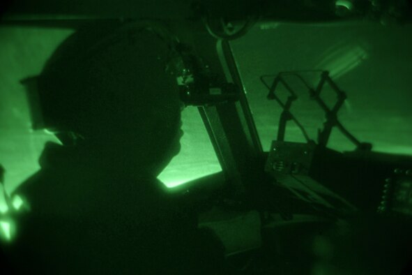 Lt. Col. James McGann, commander of the 304th Expeditionary Airlift Squadron at Christchurch, New Zealand, looks out over the ice after the first-ever night vision goggle-assisted landing on Pegasus Ice Runway near McMurdo Station, Antarctica, Sept. 11. Colonel McGann led a crew testing the concept of using night vision technology in combination with reflective cones to land safely on the ice runway after dark. The mission was flown as part of Operation Deep Freeze, commanded by U.S. Pacific Command's Joint Task Force Support Forces Antarctica.  Headquartered at Hickam AFB, Hawaii, and led by 13th Air Force, JTF SFA's mission is to provide air- and sealift support to the National Science Foundation and U.S. Antarctic Program. (US Air Force photo / Master Sgt. Chris Vadnais)