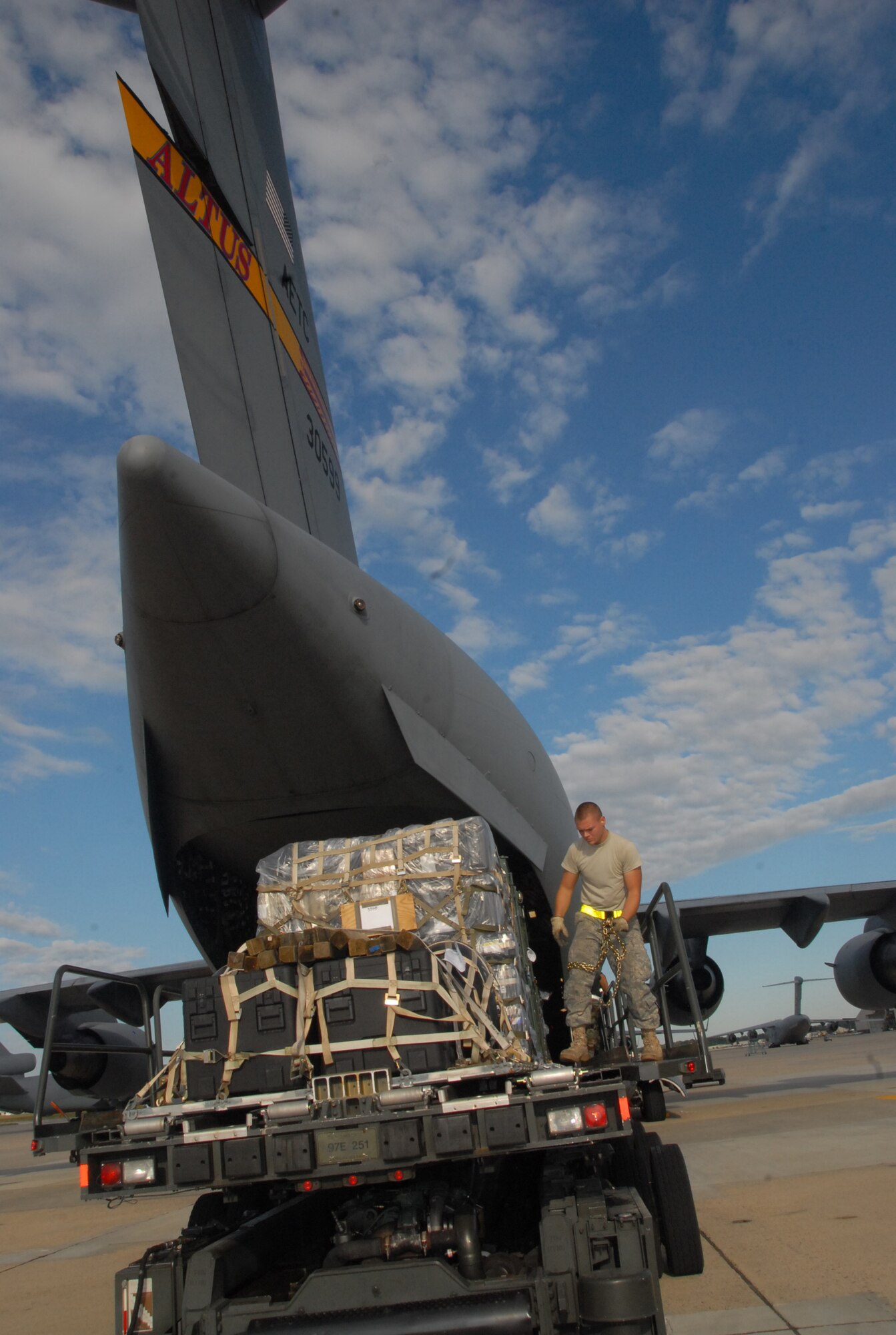 Airmen 1st Class Gregory S. Reno, from the 305th Aerial Port Squadron, McGuire Air Force Base, N.J., assists in loading a C-17 Globemaster III Sept. 10. The cargo will be used for emergency response and contingencies related to Hurricane Ike. The supplies were flown to Harlingen, Texas, by a crew assigned to the 58th Airlift Squadron at Altus AFB, Okla. (U.S. Air Force photo/Airman 1st Class Cherice I. Bryant)