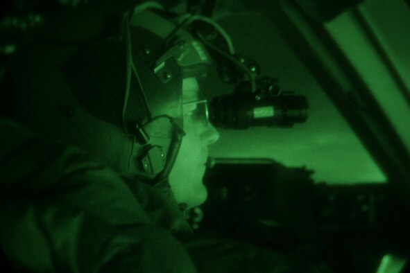 Lt. Col. Robert Weichert, a C-17 evaluator pilot with the 313th Airlift Squadron at McChord looks out over the ice after the first-ever night vision-assisted landing on Pegasus Ice Runway near McMurdo Station, Antarctica Thursday. Lieutenant Colonel Weichert is part of a crew testing the concept of using night vision technology in combination with reflective cones and limited electrical lighting to land safely on the ice runway after dark. The historic mission was conducted by Joint Task Force Support Forces Antarctica, headquartered at Hickam Air Force Base, Hawaii and led by the 13th Air Force. The joint task force is currently conducting Operation Deep Freeze in support of the National Science Foundation and U.S. Antarctic Program. (U.S. Air Force photo/Master Sgt. Chris Vadnais)