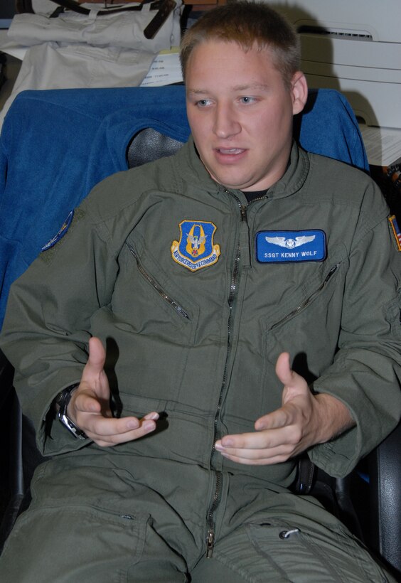 Staff Sgt. Kenny Wolf, a proud member of the 932nd Airlift Wing's Aeromedical Evacuation Squadron, relates the differeces between flying on different aircraft like a KC-135 and C-130.  Photo by Tech Sgt. Gerald Sonnenberg