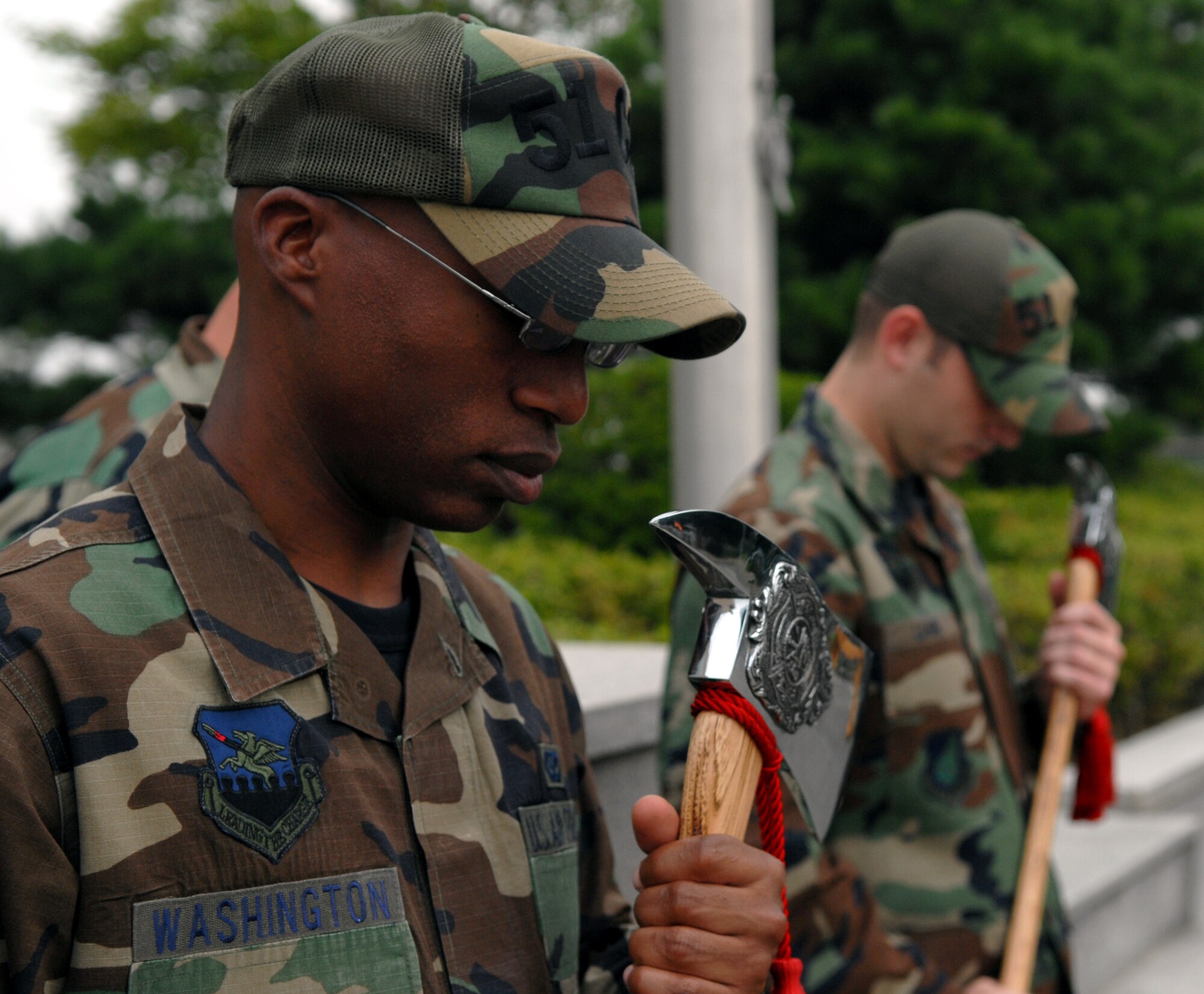 At 9:11 a.m., members of Team Osan gathered together at the base flag pole Sept. 11 to remember all who died, and whose lives were forever changed as a result of the Sept. 11, 2001 attacks. The memorial reminded everyone in attendance of why every servicemember, civilian and family member must do their part to keep our country safe and provide freedom to its people. (U.S. Air Force photo/Senior Airman Christopher Boitz)