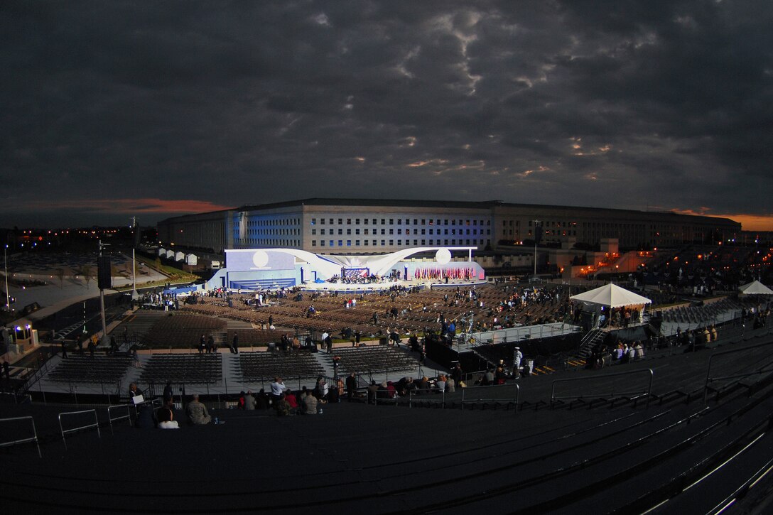 The sun rises over the main stage before the start of the Pentagon Memorial dedication ceremony Sept. 11 at Alexandria, Va. The national memorial is the first to be dedicated to those killed at the Pentagon on Sept. 11, 2001. The site contains 184 inscribed memorial units honoring the 59 people aboard American Airlines Flight 77 and the 125 in the building who lost their lives that day. (Defense Department photo/Master Sgt. Adam Stump)