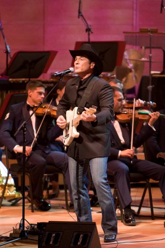 Country Music superstar Clint Black regaled the audience with his hit songs “The Shoes You’re Wearing” and “Spend My Time” as part of the U.S. Air Force Band television special titled “America’s Veterans: A Musical Tribute.” The show was taped at the Music Center at Strathmore in North Bethesda, Md., and will air nationally on public television and overseas on American Forces Network over the Veterans Day holiday. Also appearing on the program are two-time Grammy Award-winner Patti LaBelle, Academy Award-winning Actor Cliff Robertson and ukulele master Jake Shimabukuro.