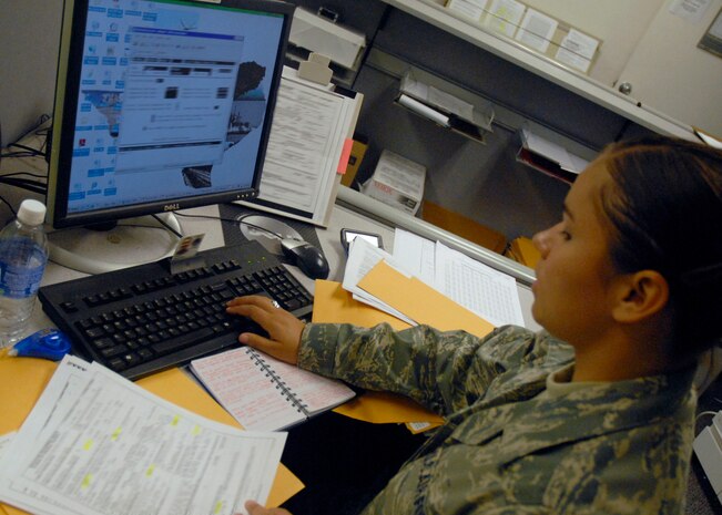 Airman 1st Class Briana Gutierrez updates a military member's information for a permanent change of station on Charleston AFB Sept. 10. The base traffic management office oversees all aspects of a PCS move to include tracking household items, coordinating personal property moves and vehicle movements. Airman Gutierrez is a traffic management journeyman with the 437th Aerial Port Squadron. (U.S. Air Force photo/Tech. Sgt. David Watson)