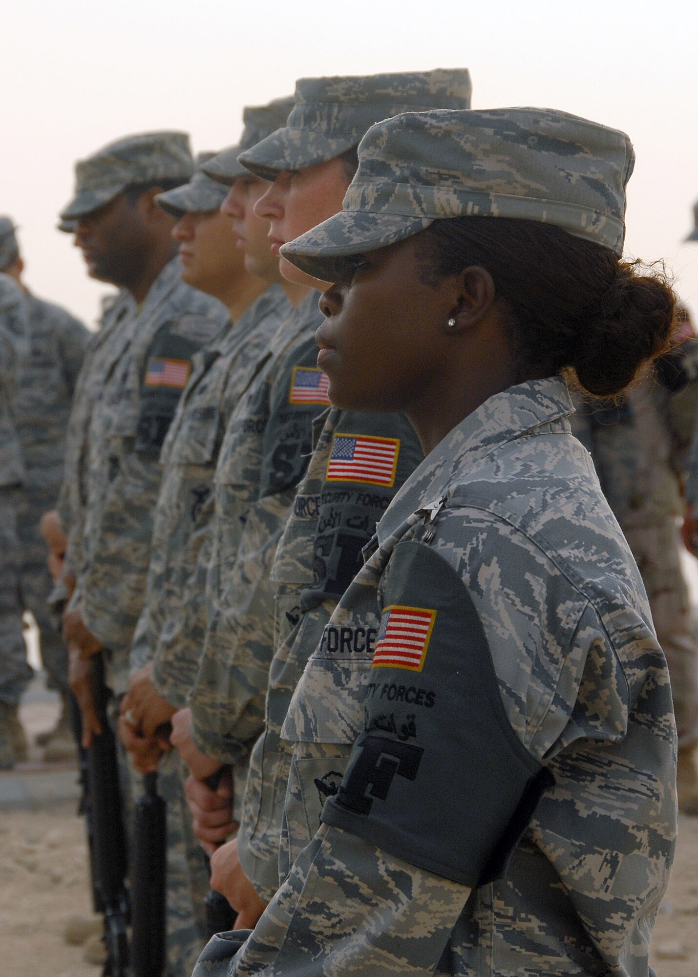 Members of the 387th Air Expeditionary Group rifle team prepare to render a 21-gun salute during the Sept. 11 Remembrance ceremony Sept. 11 at an air base in Southwest Asia. The ceremony included a wreath-laying ceremony and the playing of "Taps" to honor the memory of those that perished and survived the terrorist attacks of Sept. 11, 2001. (U.S. Air Force photo/Tech. Sgt. Raheem Moore) 
