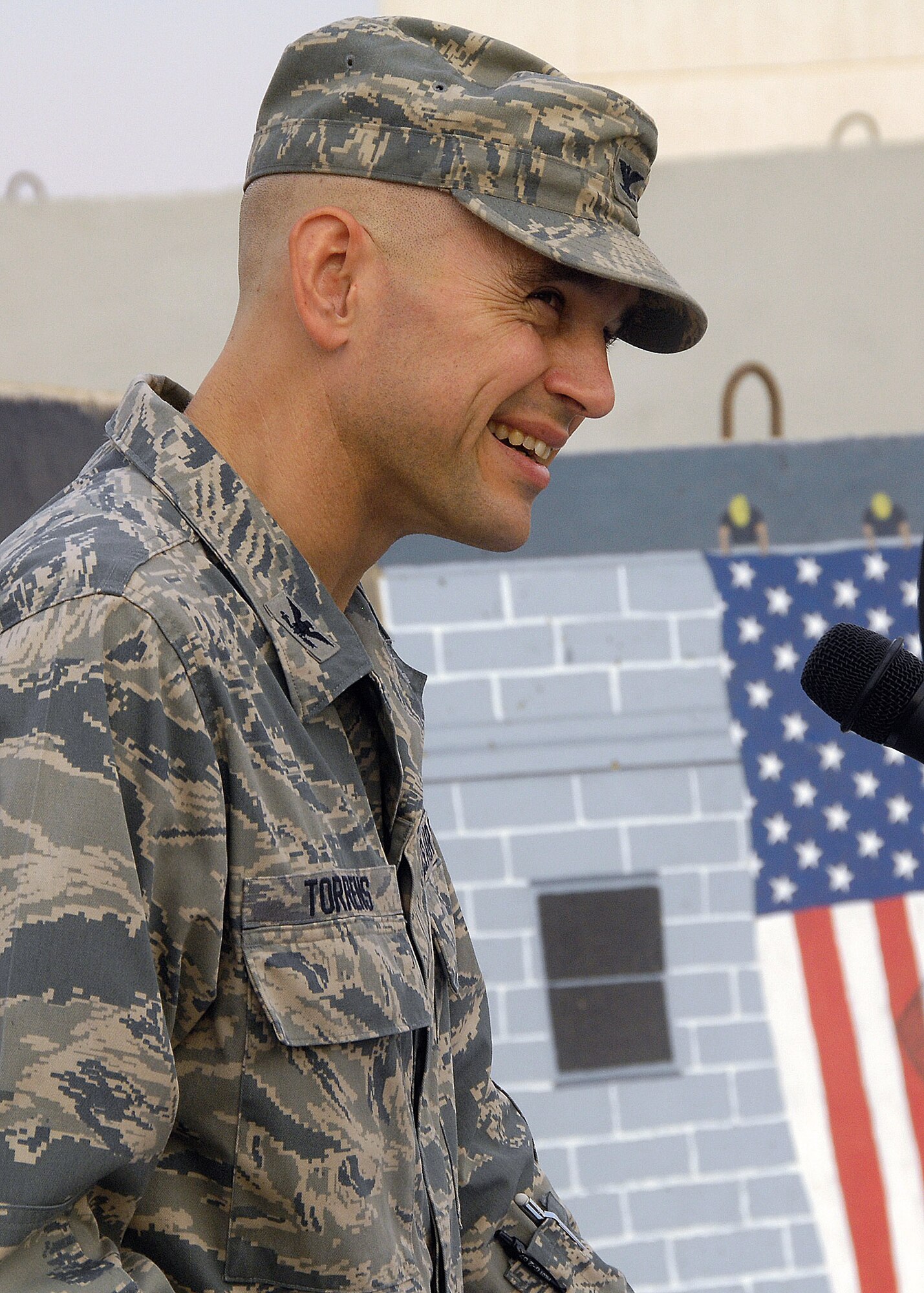 Col. Cameron Torrens gives a speech on the events of Sept. 11, 2001, and the way they changed the military mindset during the Sept. 11 Remembrance Ceremony Sept. 11 at an air base in Southwest Asia. The ceremony included a wreath-laying ceremony, a 21-gun salute and the playing of "Taps" to honor the memory of those that perished and survived the terrorist attacks of Sept. 11, 2001. Colonel Torrens is the 386th Air Expeditionary Wing commander. (U.S. Air Force photo/Tech. Sgt. Raheem Moore) 
