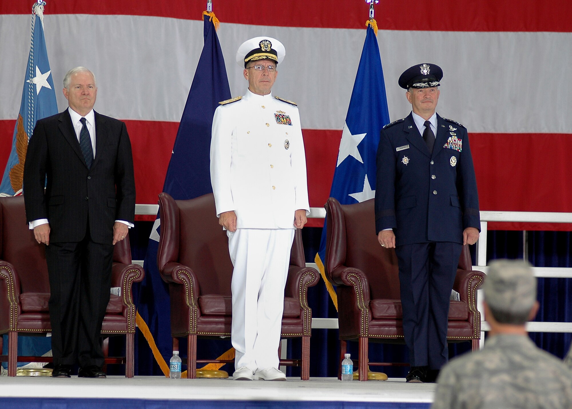 Secretary of Defense Robert M. Gates, Chairman of the Joint Chiefs of Staff Adm. Mike Mullen and Gen. Duncan J. McNabb stand at attention, priornited States Te troops in attendance for the United States Transportation Command assumption of command ceremony Friday.

(U.S. Air Force photo/ Bob Fehringer)