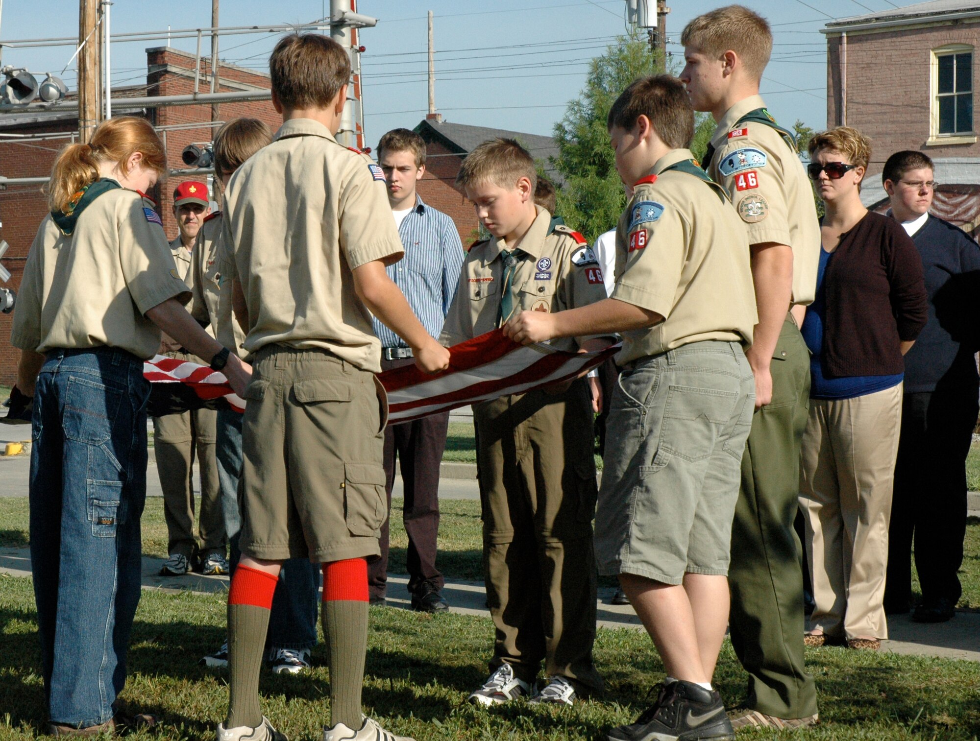 O'Fallon community members gathered Sept. 6 to honor the service of Air Force Capt. Karl Youngblood who died with 11 other Airmen during a HH-60G Pave Hawk training rescue mission Sept. 3, 1998. About 75 people gathered with Captain Youngblood's widow, Lee Anne, to commemorate Captain Youngblood's service with the ceremonial raising of the U.S. flag by O'Fallon's Boy Scout Troop 46. Members of the city's high school chamber choir also performed. O'Fallon commemorates the life of a servicemember with a similar ceremony each month.

(U.S. Air Force photo/ Lt. Col. Lindsey Borg)