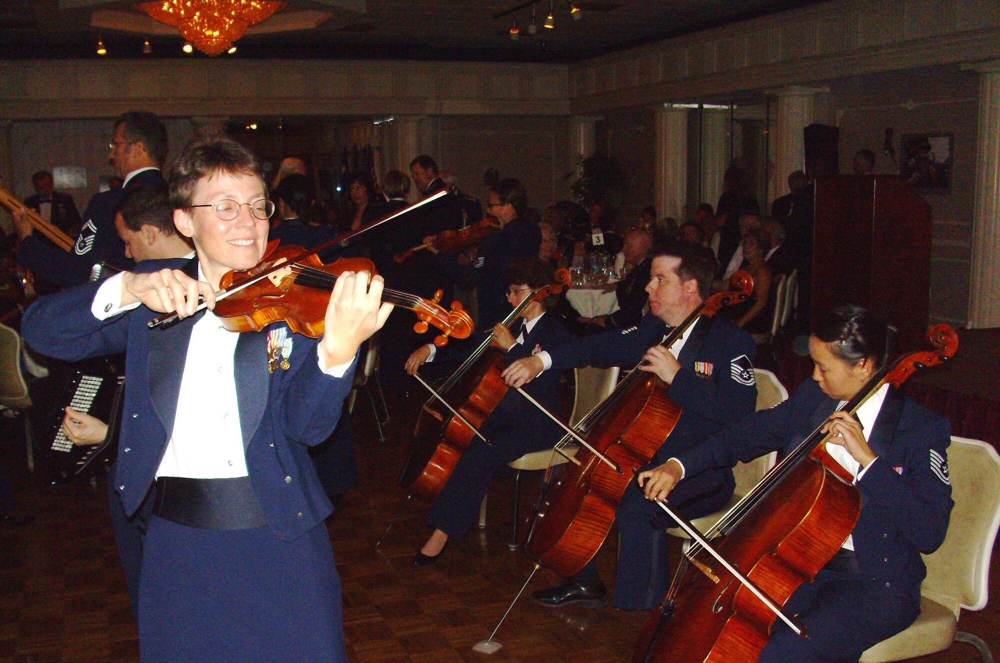 MCGUIRE AIR FORCE BASE, N.J. -- Members of the Air Force Strolling Strnigs provide entertainment during the 514th Air Mobility Wing's Military Ball held Sept. 6 at the Grand Varsailles Ballroom located in Mount Laurel, N.J. Close to 450 military members, retirees and guests celebrate the 60th Anniversary of the Air Force Reserve. (U.S. Air Force photo/Master Sgt. Derek Williams)