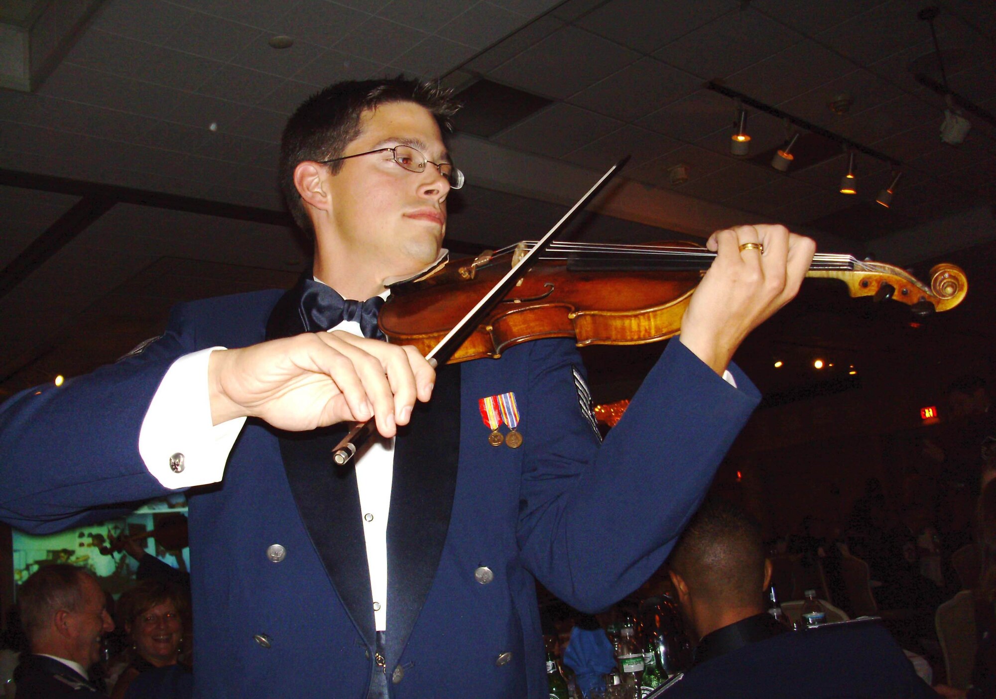 MCGUIRE AIR FORCE BASE, N.J. -- A violinist with the  Air Force Strolling Strnigs provide entertainment during the 514th Air Mobility Wing's Military Ball held Sept. 6 at the Grand Varsailles Ballroom located in Mount Laurel, N.J. Close to 450 military members, retirees and guests celebrate the 60th Anniversary of the Air Force Reserve. (U.S. Air Force photo/Master Sgt. Derek Williams)
