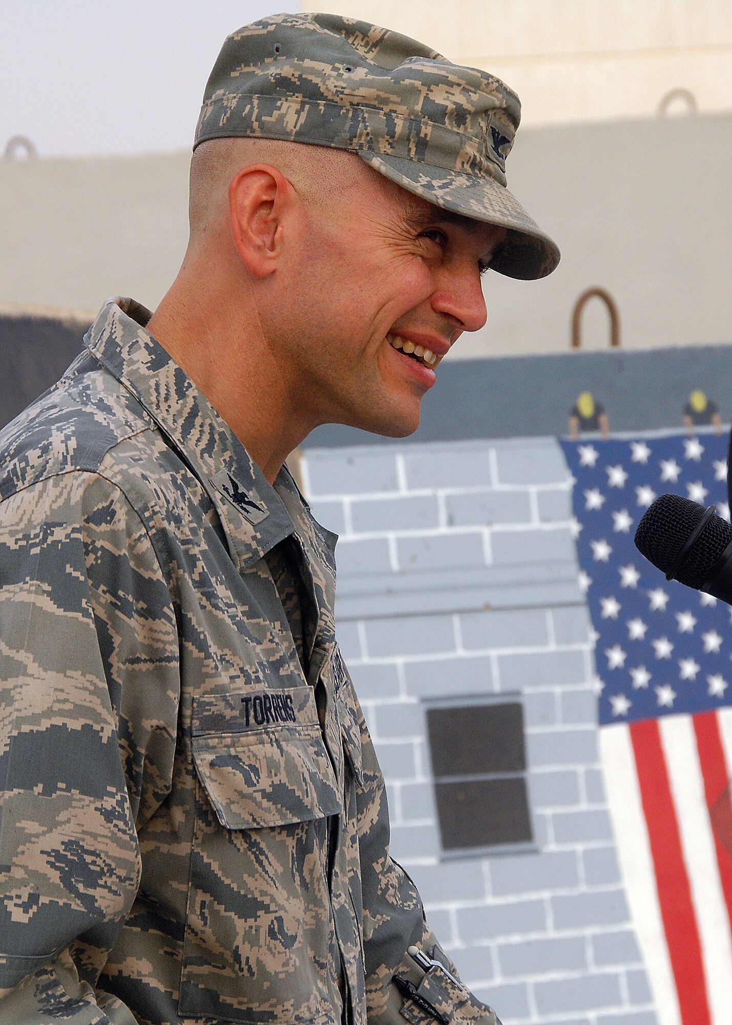SOUTHWEST ASIA -- Col. Cameron Torrens, 386th Air Expeditionary Wing commander, gives a speech on the events of Sept. 11, 2001 and the way they changed the military mindset during the 9/11 remembrance ceremony on Sept. 11 at an air base in Southwest Asia. The ceremony included a wreath laying ceremony, a twenty-one-gun salute and the playing of taps to honor the memory of those that perished and survived the terrorist attacks of Sept. 11. (U.S. Air Force photo/Tech. Sgt. Raheem Moore)