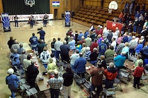 MINOT AIR FORCE BASE, N.D. -- Residents of Ryder, N.D., rise to their feet Sept. 4 during the playing of "God Bless America" by Night Wing, a popular and country music ensemble with the U.S. Air Force Heartland of America Band out of Offutt AFB, Neb. The 91st Missile Wing sponsored the performance to show its appreciation to Ryder for the residents' support of the wing's ICBM mission. Approximately 150 people attended the event, which included a "burger burn" courtesy of the 741st Missile Squadron. (U.S. Air Force photo by Senior Airman Kelly Timney)