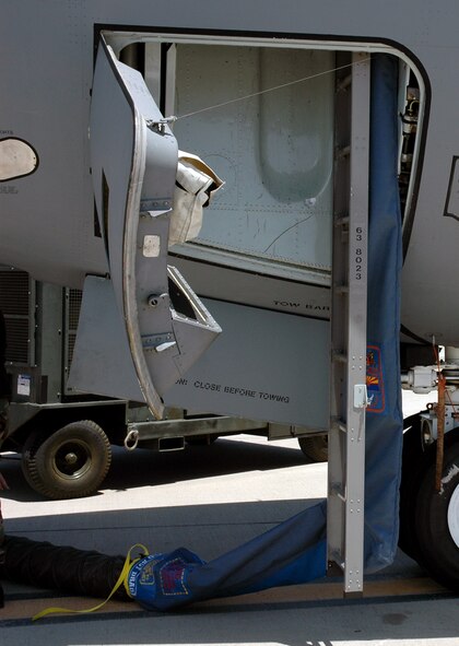 This photo shows a fabricated cooling sock as it is attached behind the crew entry ladder to the flight deck of a KC-135R Stratotanker at Sky Harbor Airport in Phoenix, Ariz., in June 2008, where the demonstration for the Air Mobility Battlelab's  KC-135 Hot Weather Cooling Sock initiative took place.  The use of the cooling sock has been recommended for fielding to Air Mobility Command by the AMB, which is located at the U.S. Air Force Expeditionary Center on Fort Dix, N.J.  (U.S. Air Force Photo)