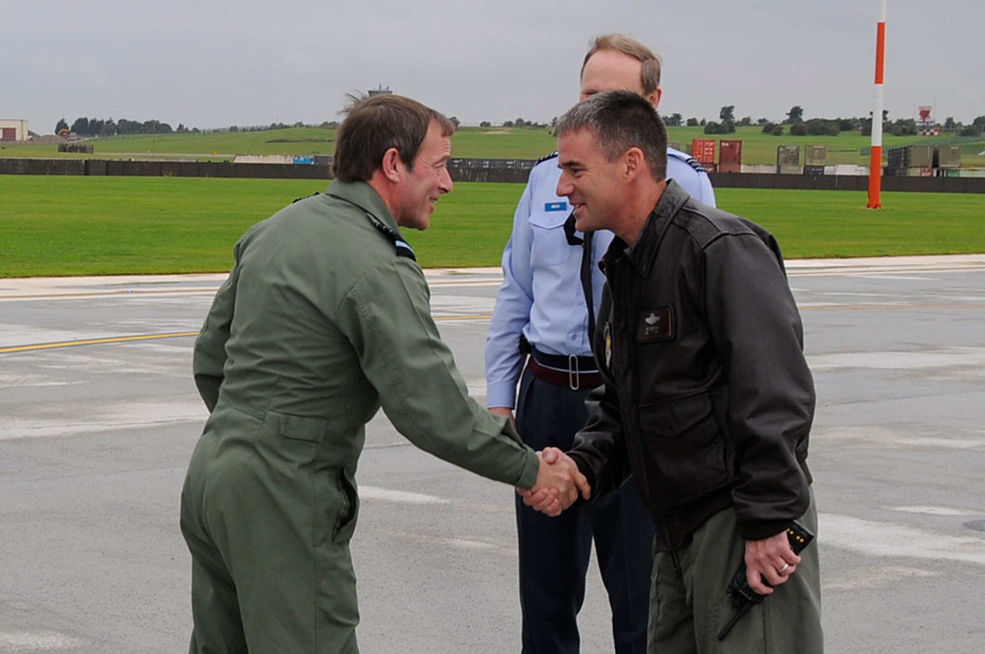 Air Chief Marshall Glenn Torpy, Chief of the Air Staff, Royal Air Force shakes hands with Col. Jay Silveria, 48th Fighter Wing commander, after landing at RAF Lakenheath, England, Sept. 8. Air Chief Marshall Torpy received an orientation flight in an F-15 Eagle. (U.S. Air Force photo by Senior Airman Brian J. Ellis)
