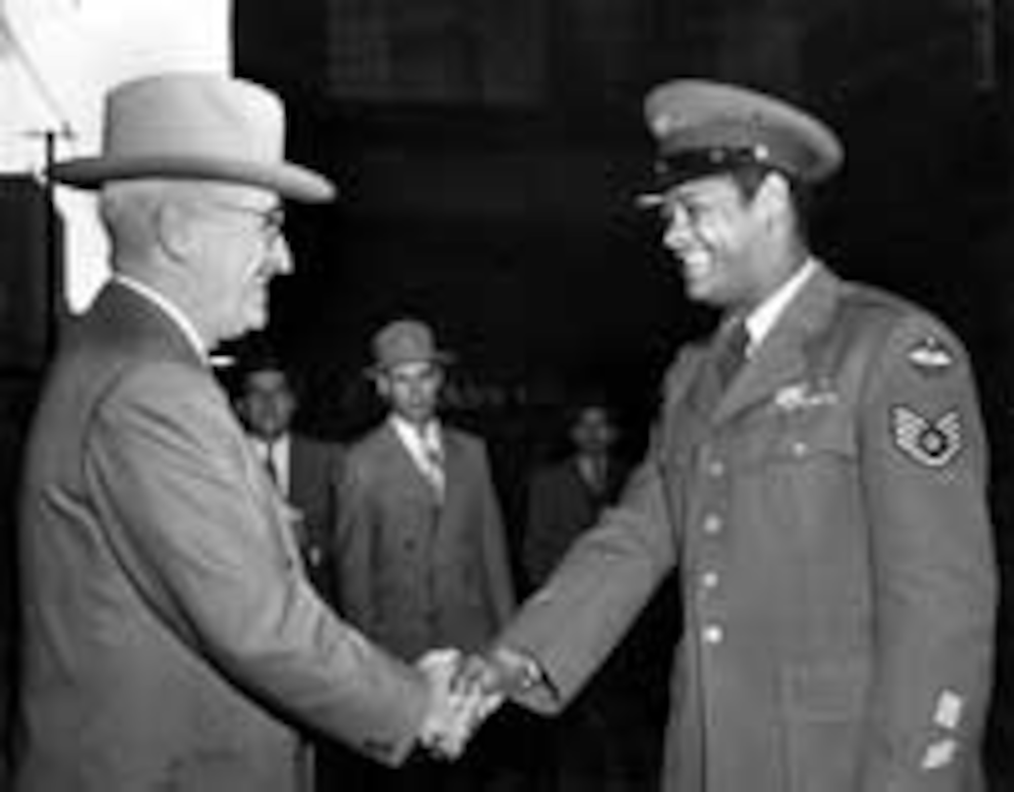 U.S. Air Force Staff Sergeant Edward Williams of St. Louis, exchanges a hearty handshake with his Commander-in-Chief, President Harry S. Truman, Oct. 13, 1950, at a casual meeting during the President's morning walk. Williams had been in the Air Force nine years at the time of this photograph. (Courtesy photo)