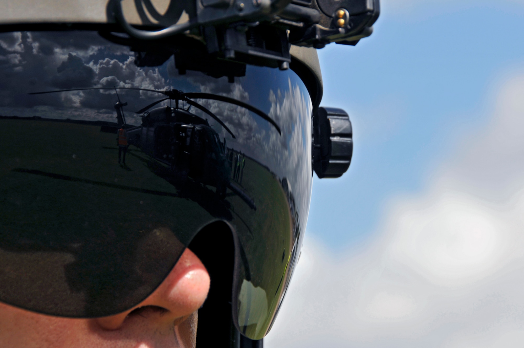 Capt. Timothy Fagen, 56th Rescue Squadron watches as the aircrew prepares to start the pre-flight checklist at Duxford, England. The 56th squadron was participating in an aviation event at the Imperial War Museum in Duxford. (U.S. Air Force photo by Airman 1st Class Perry Aston)