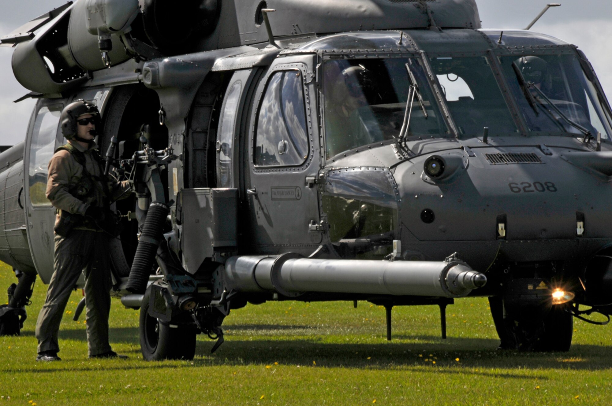 Senior Airman Derek Brock, 56th Rescue Squadron goes through the shut down checklist at Duxford, England. The aircrew must properly shut down the helicopter to prevent any maintenance issues. (U.S. Air Force photo by Airman 1st Class Perry Aston)