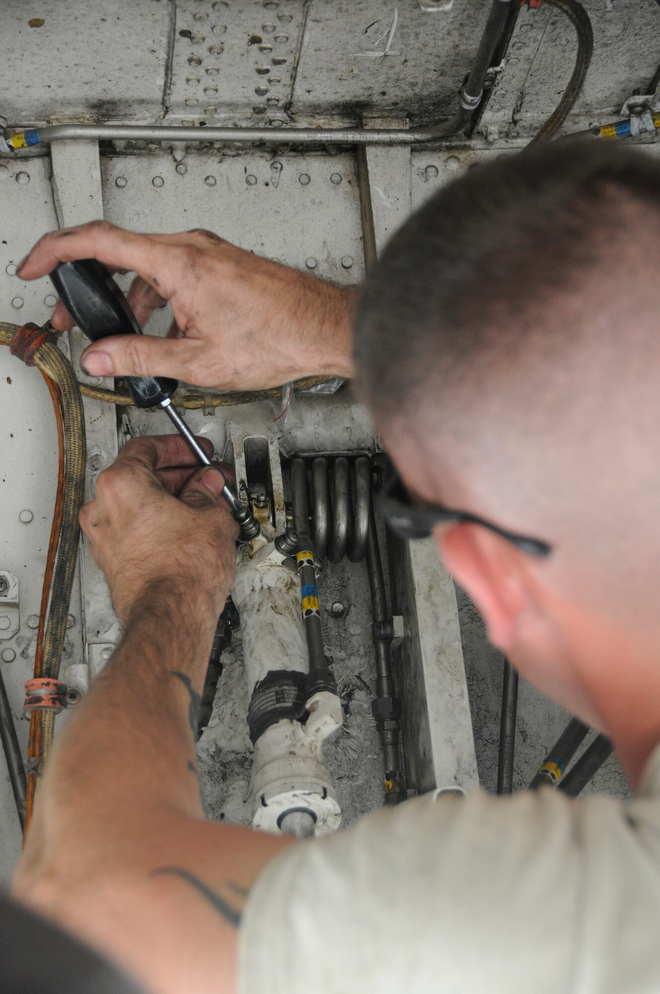 Staff Sgt. Bradley Klepac, hydraulic craftsman for the 76th Expeditionary Depot Maintenance Squadron, installs an actuator which locks landing gear into place once the landing gear is up Sept. 10, 2008, at an undisclosed air base in Southwest Asia. The expeditionary depot team deployed here to replace the entire nose landing gear.  The B-1B is often called upon to deliver precision bombs in support of Operations Iraqi and Enduring Freedom. Sergeant Klepac, a native of Bandera, Texas, is deployed from Tinker Air Force Base, Okla. (U.S. Air Force photo by Staff Sgt. Darnell T. Cannady/Released)