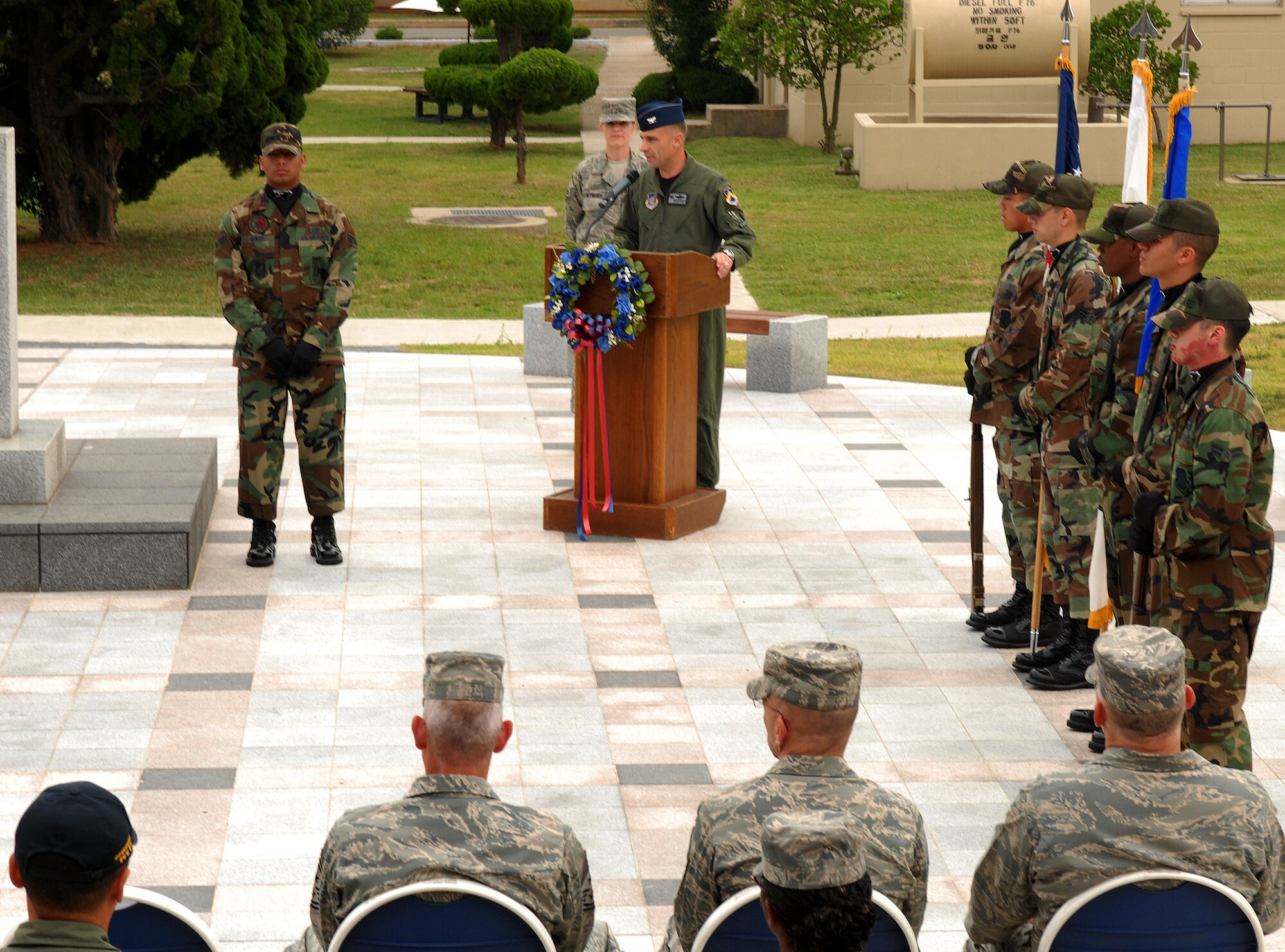 KUNSAN AIR BASE, Republic of Korea -- Col. Bryan ?WOLF? Bearden, the 8th Fighter Wing commander, speaks about his 9/11 experience during the a ceremony here, Sept. 11 at the base?s Medal of Honor monument. The remembrance ceremony has been held each year here to honor the fallen in the attacks Sept. 11, 2001. (U.S. Air Force photo/Senior Airman Gustavo Gonzalez)